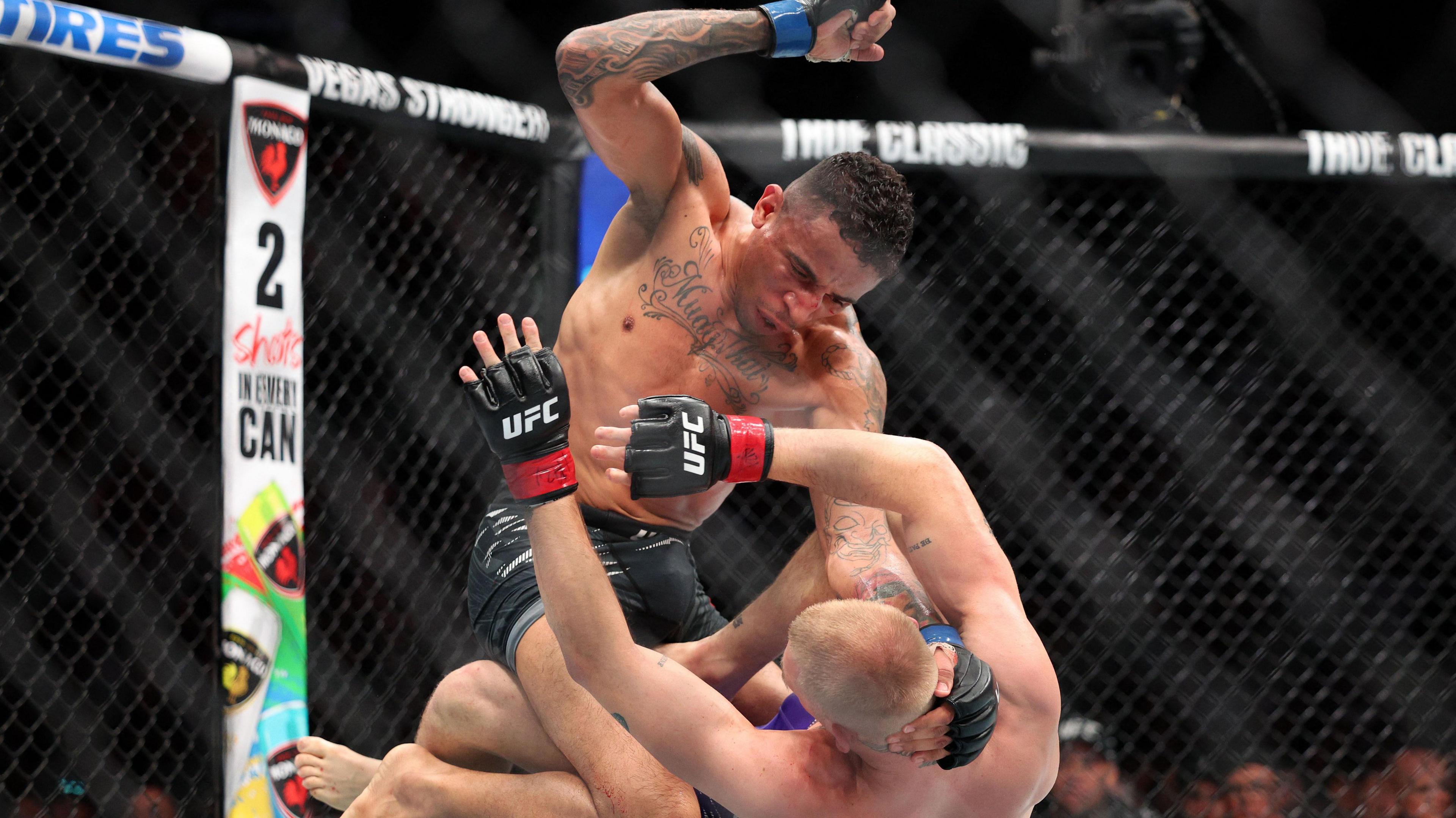 Carlos Prates punches a grounded Ian Machado Garry