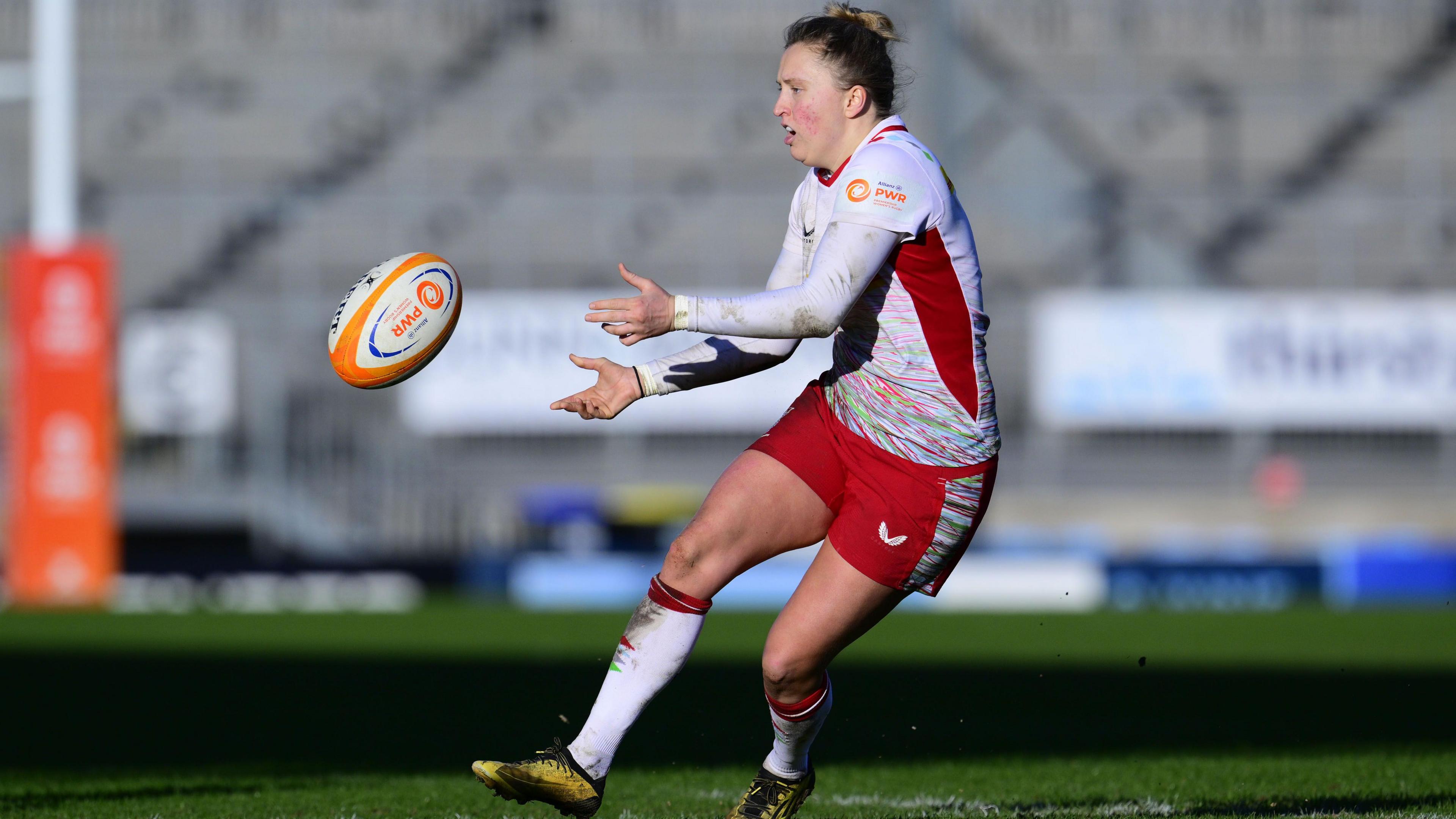 Emily Scott passes the ball