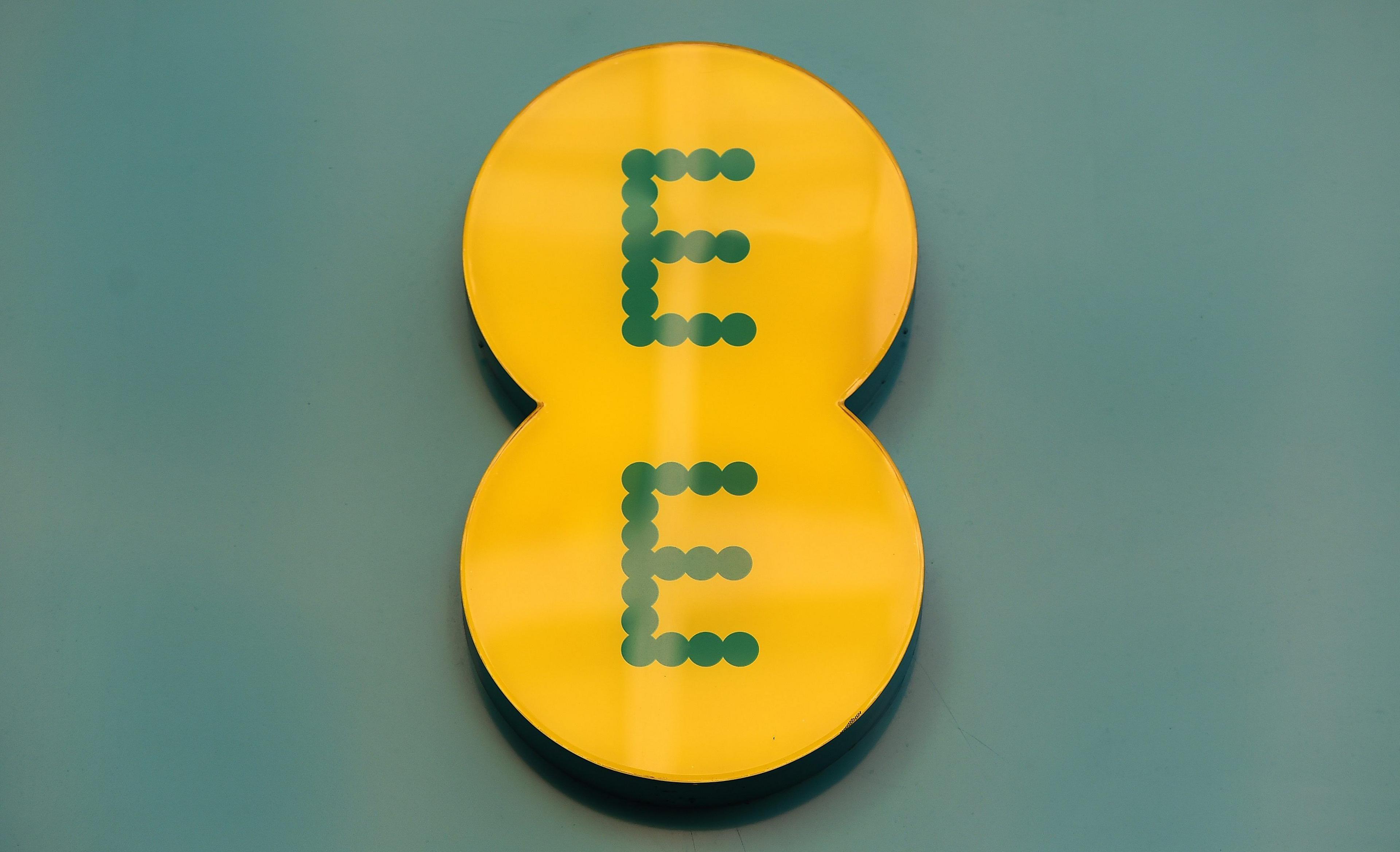 EE logo in green dots on yellow and green background