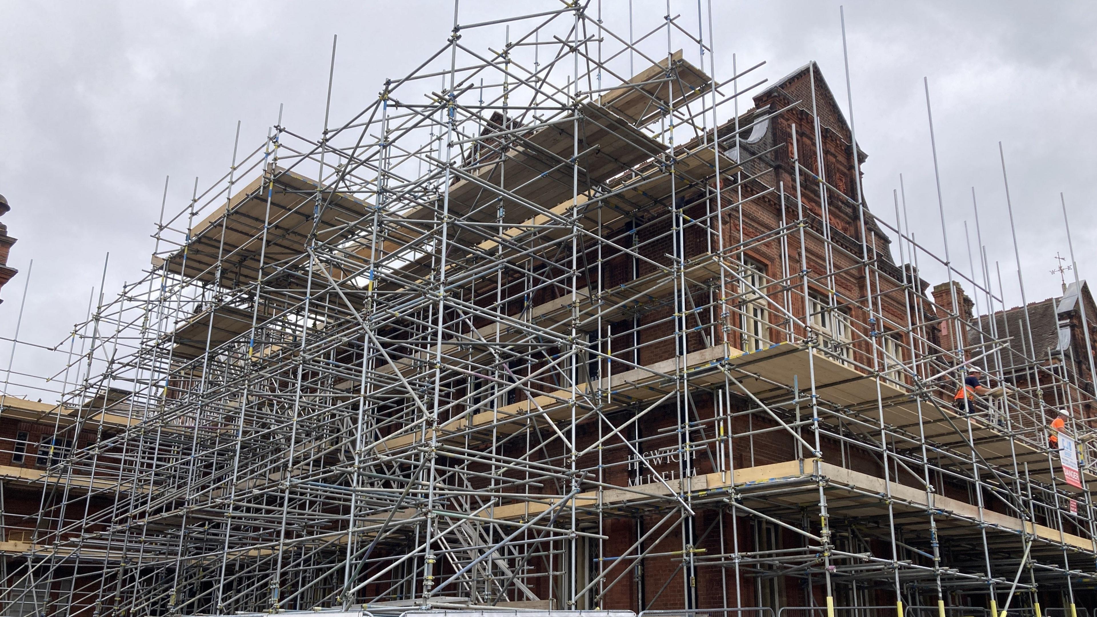 The exterior of Ipswich Museum covered in scaffolding during its renovation work.