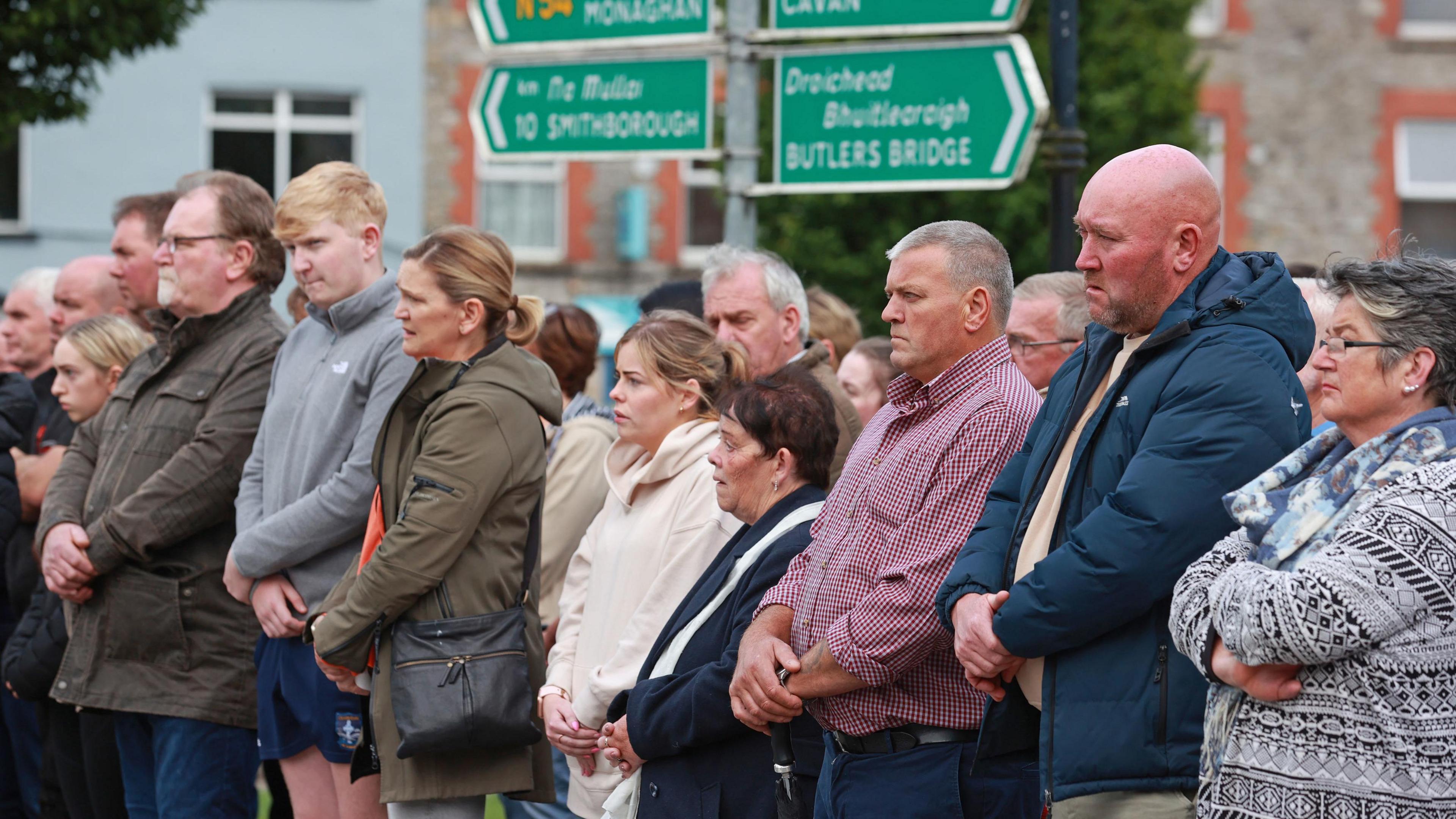 People await the hearse carrying the remains of Dlava Mohamed as they are brought to the family home in Clones