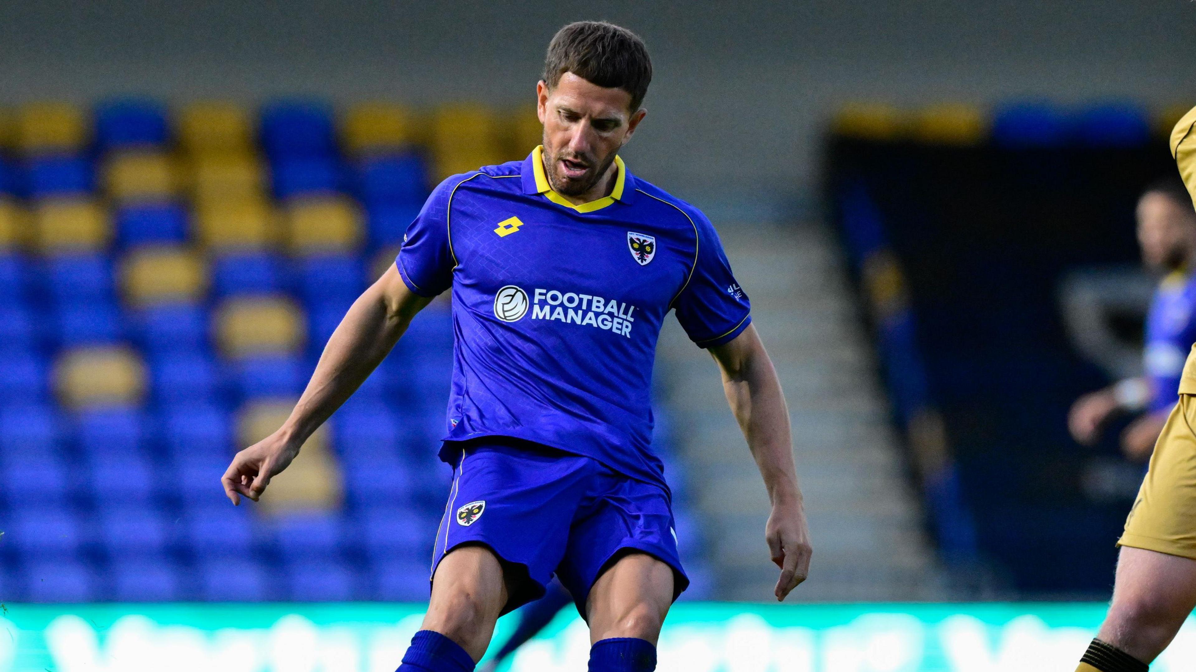 Sam Hutchinson in action for AFC Wimbledon 