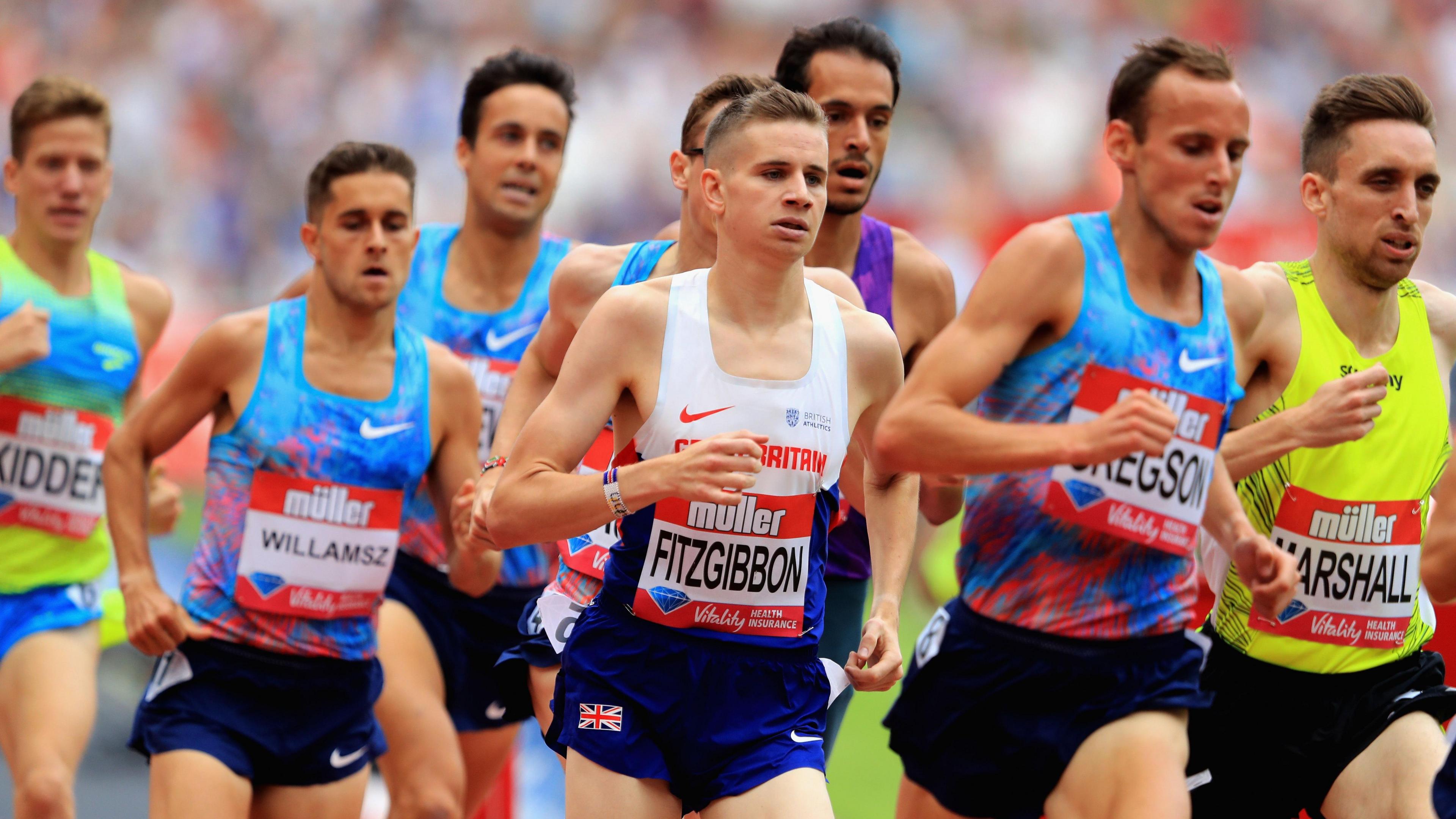 Robbie Fitzgibbon is running in a red, white and blue Great Britain vest, surrounded by other athletes