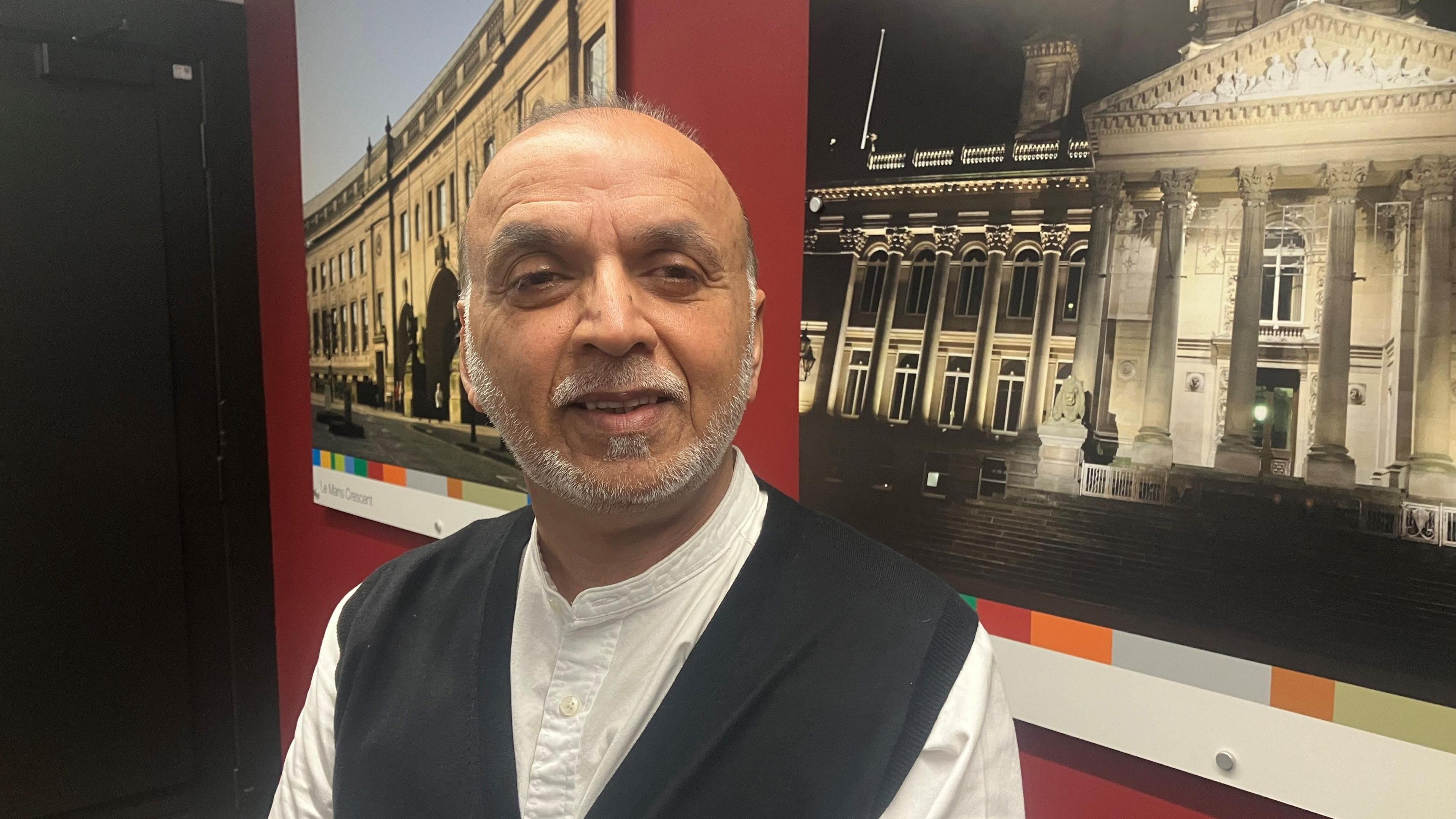 Councillor Akhtar Zaman, the Deputy Leader of Bolton Council shown in an office at Bolton town hall.