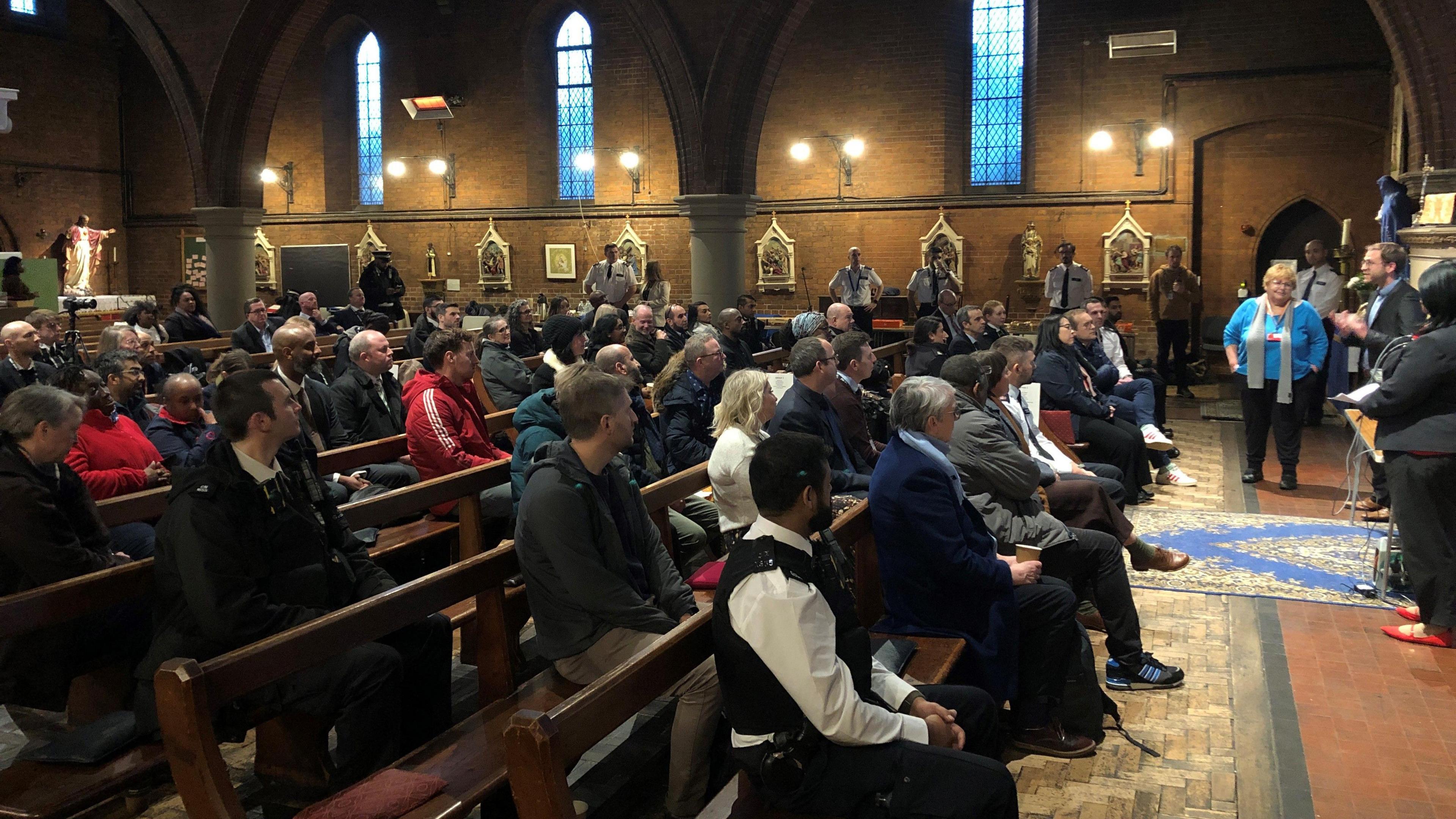 People at meeting in north London church hall 