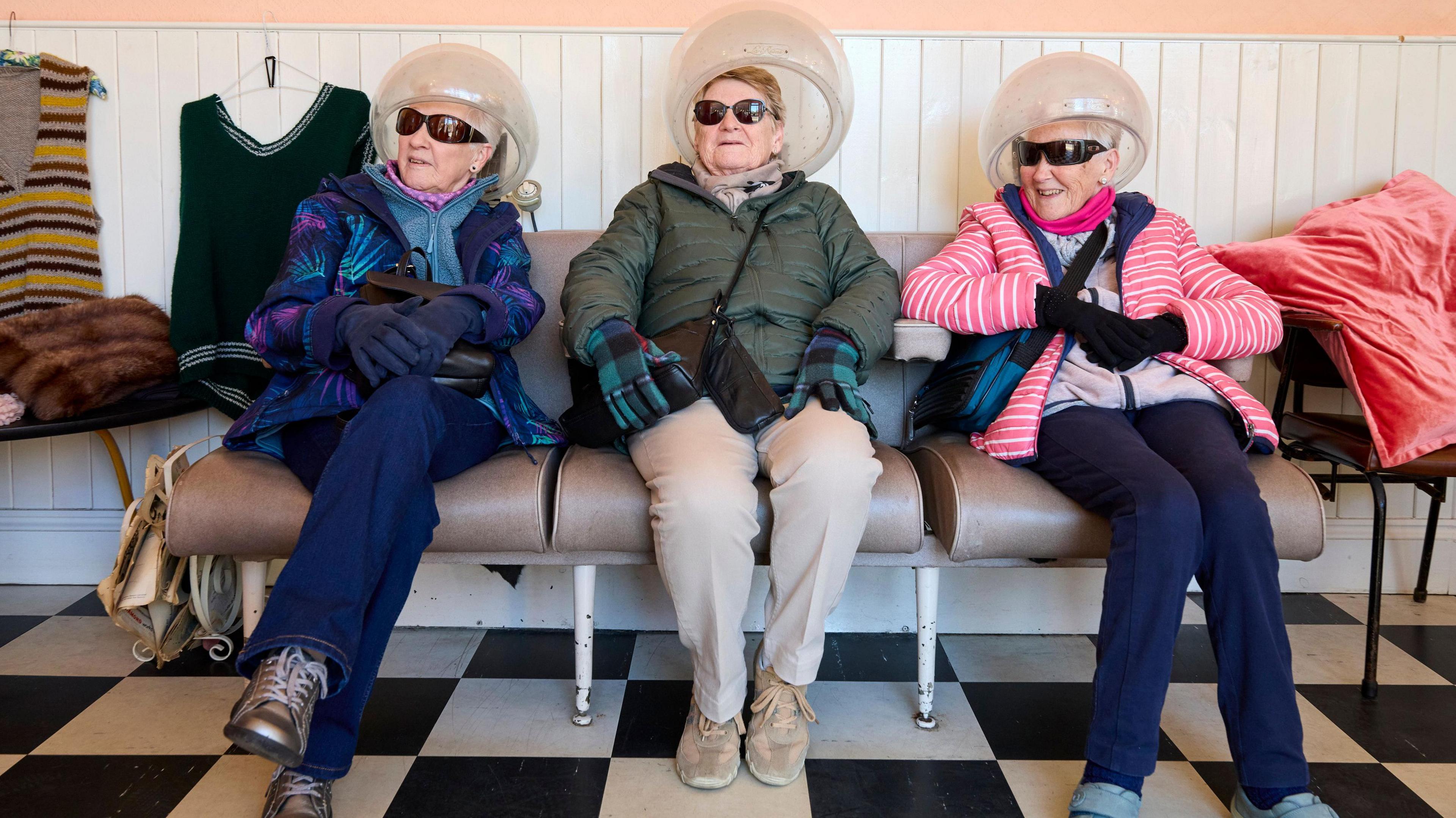 Women wait in a re-created hairdresser