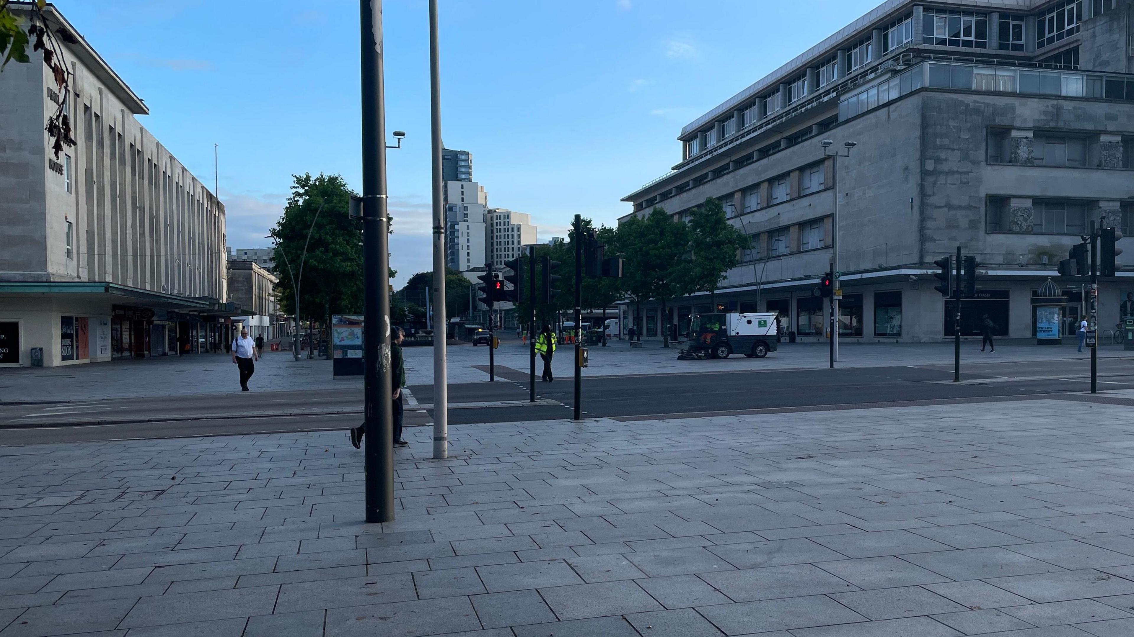 Street cleaners on Plymouth's Royal Parade