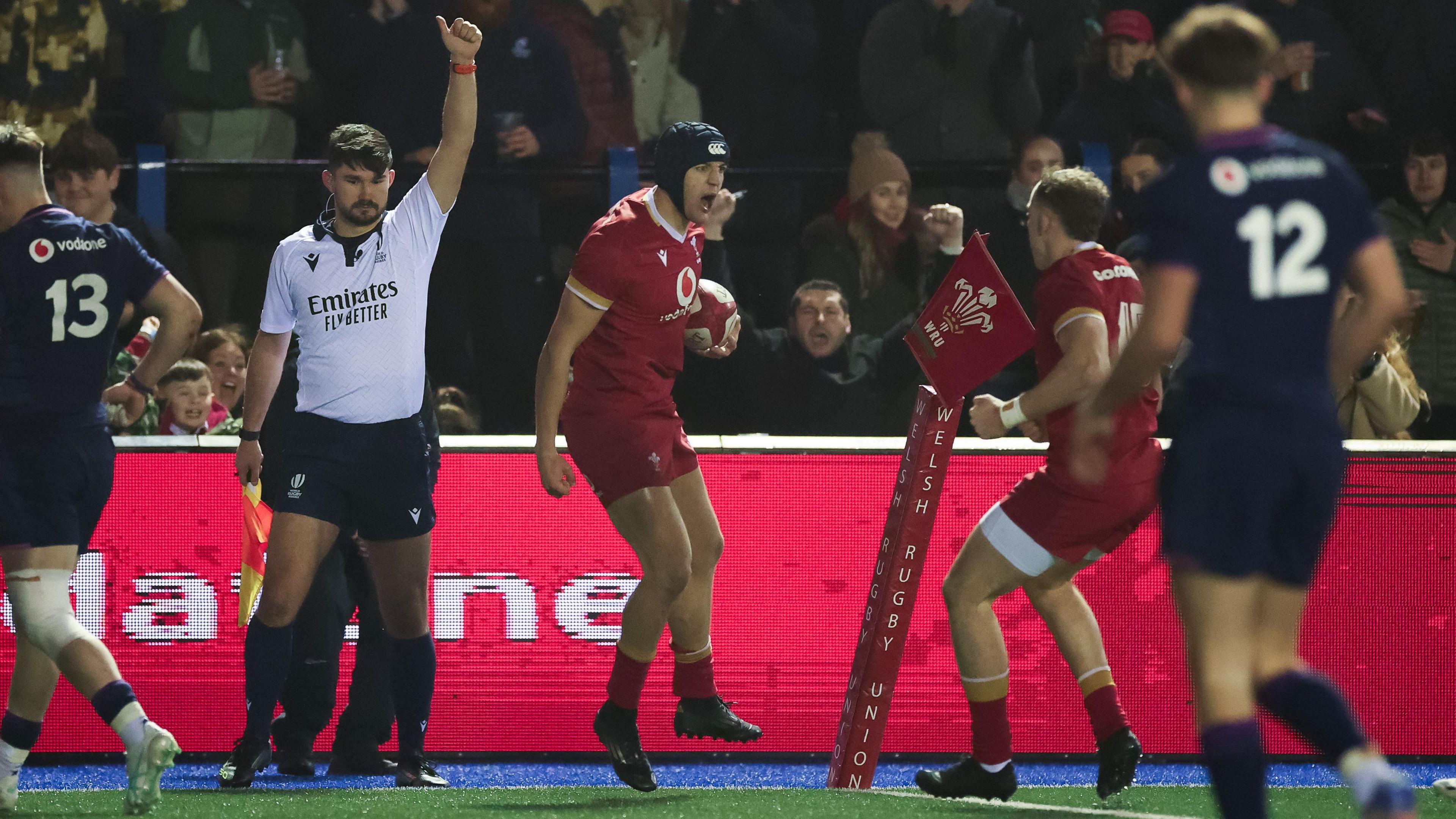 Dylan Scott (C) celebrates his try for Wales Under-20s against Scotland