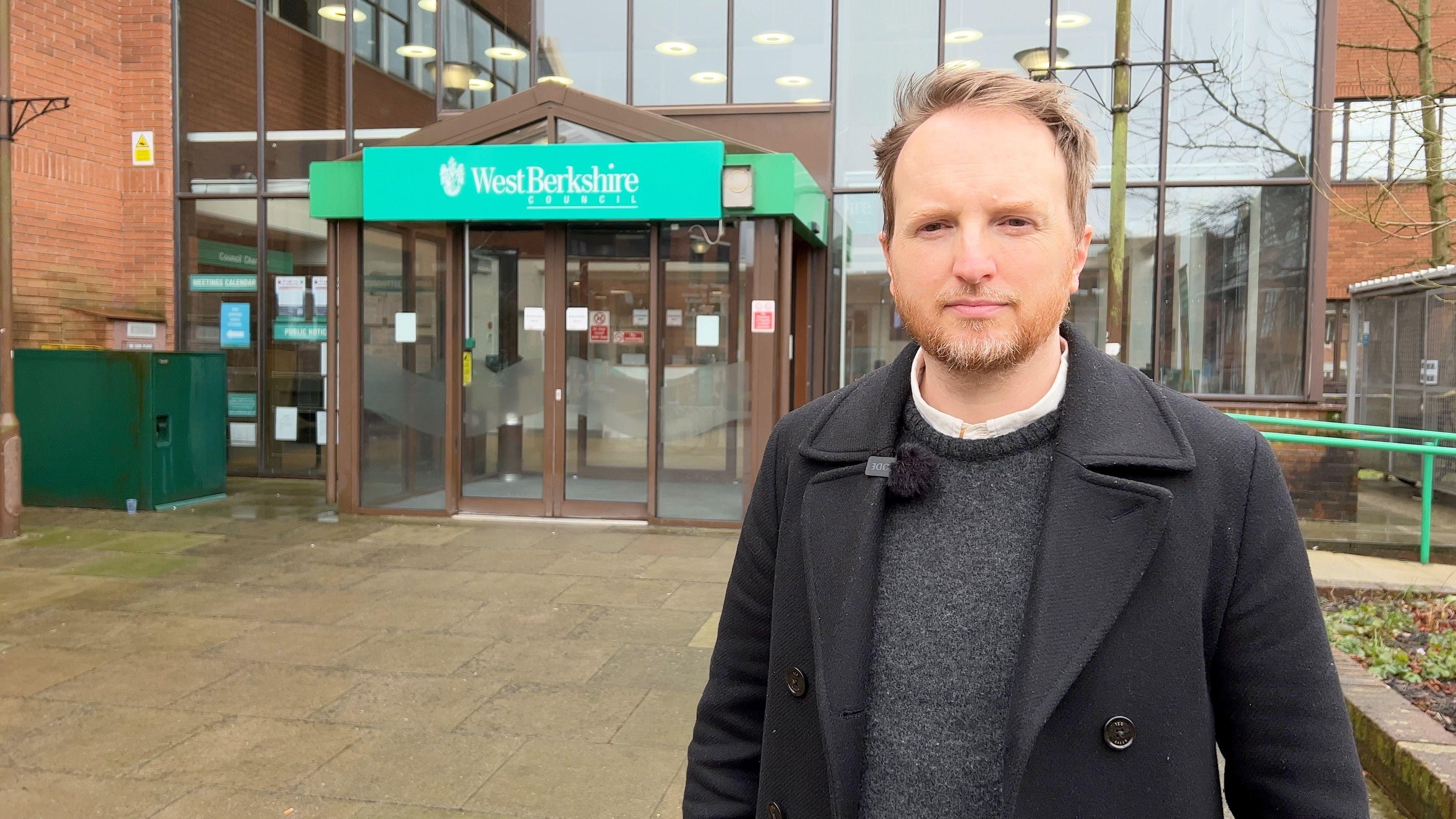 Kieran Pearson the union official, representing staff at the centres, stands outside West Berkshire Council's headquarters.