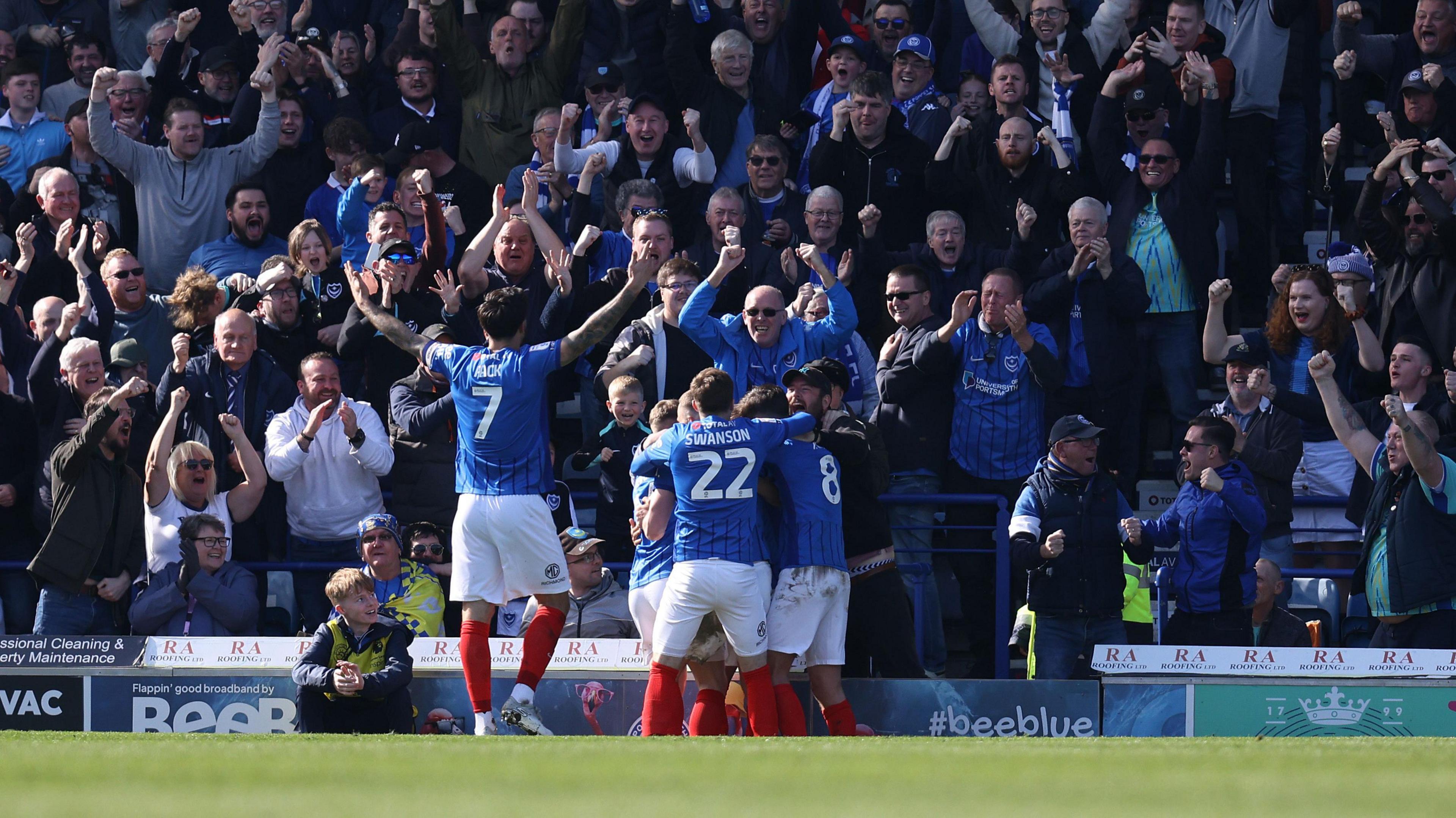 Fans celebrate after Portsmouth score against Leeds United at Fratton Park