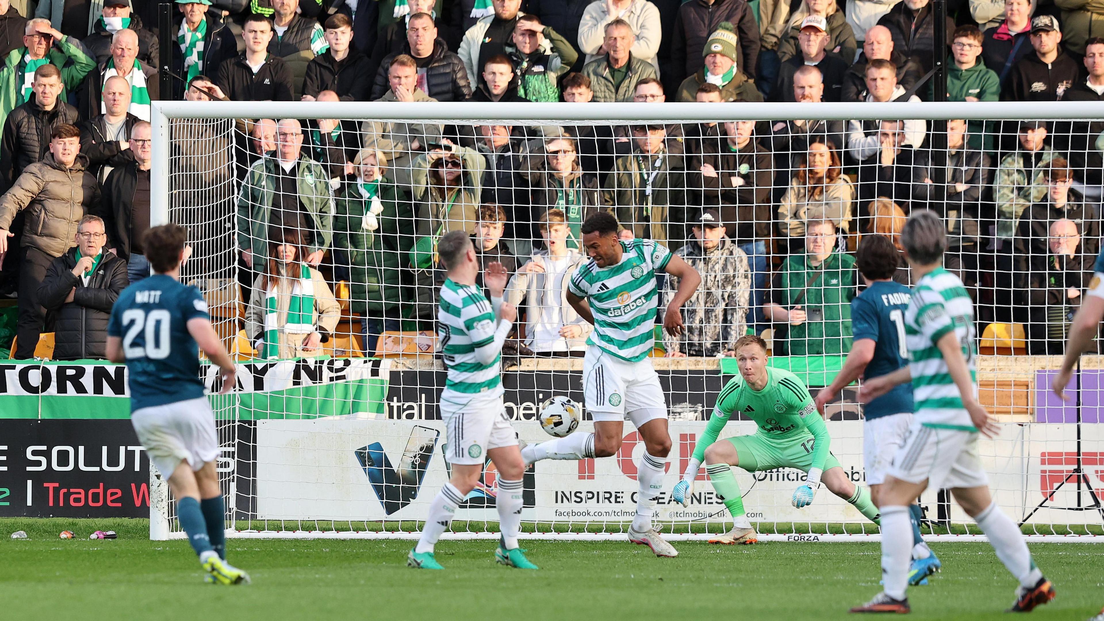 Motherwell's Elliot Watt scores their side's first goal during the match.