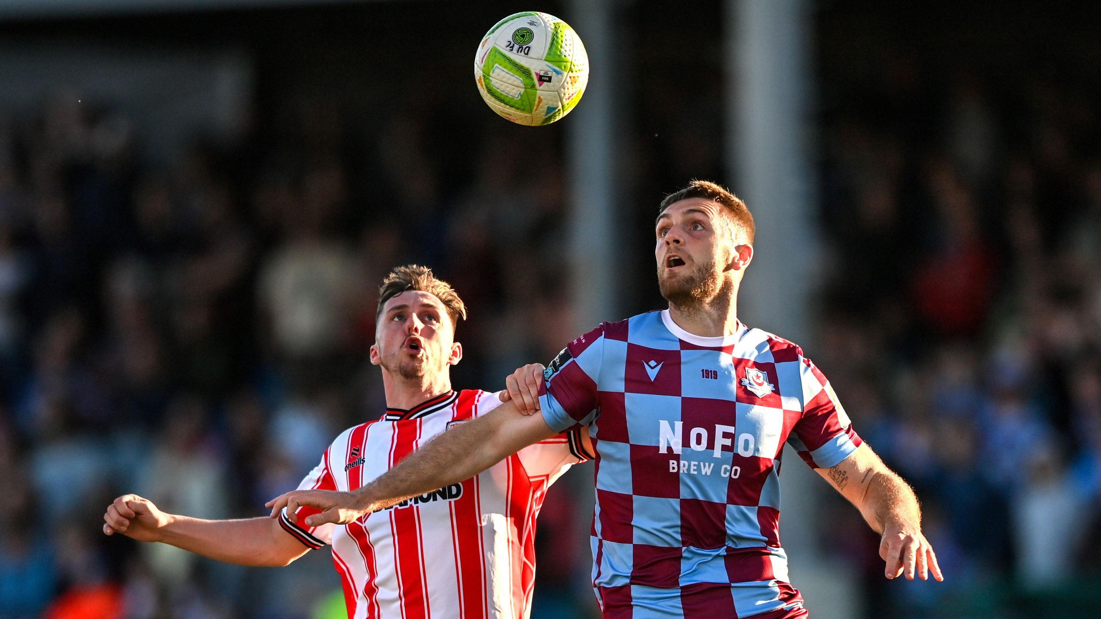 Gavin Whyte battling with Conor Keeley for the ball at Sullivan and Lambe Park