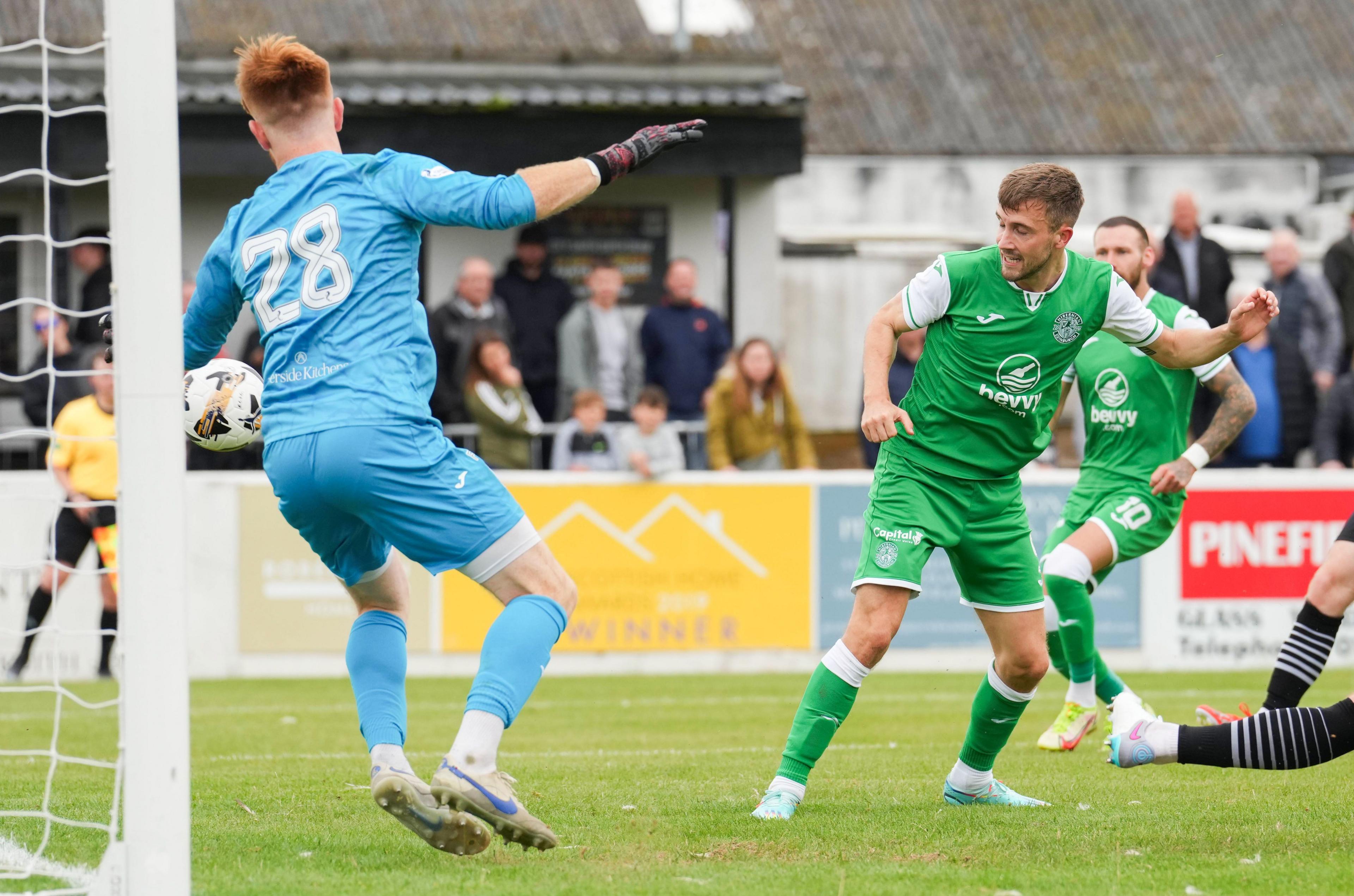 Hibs' Dylan Vente (right) scores