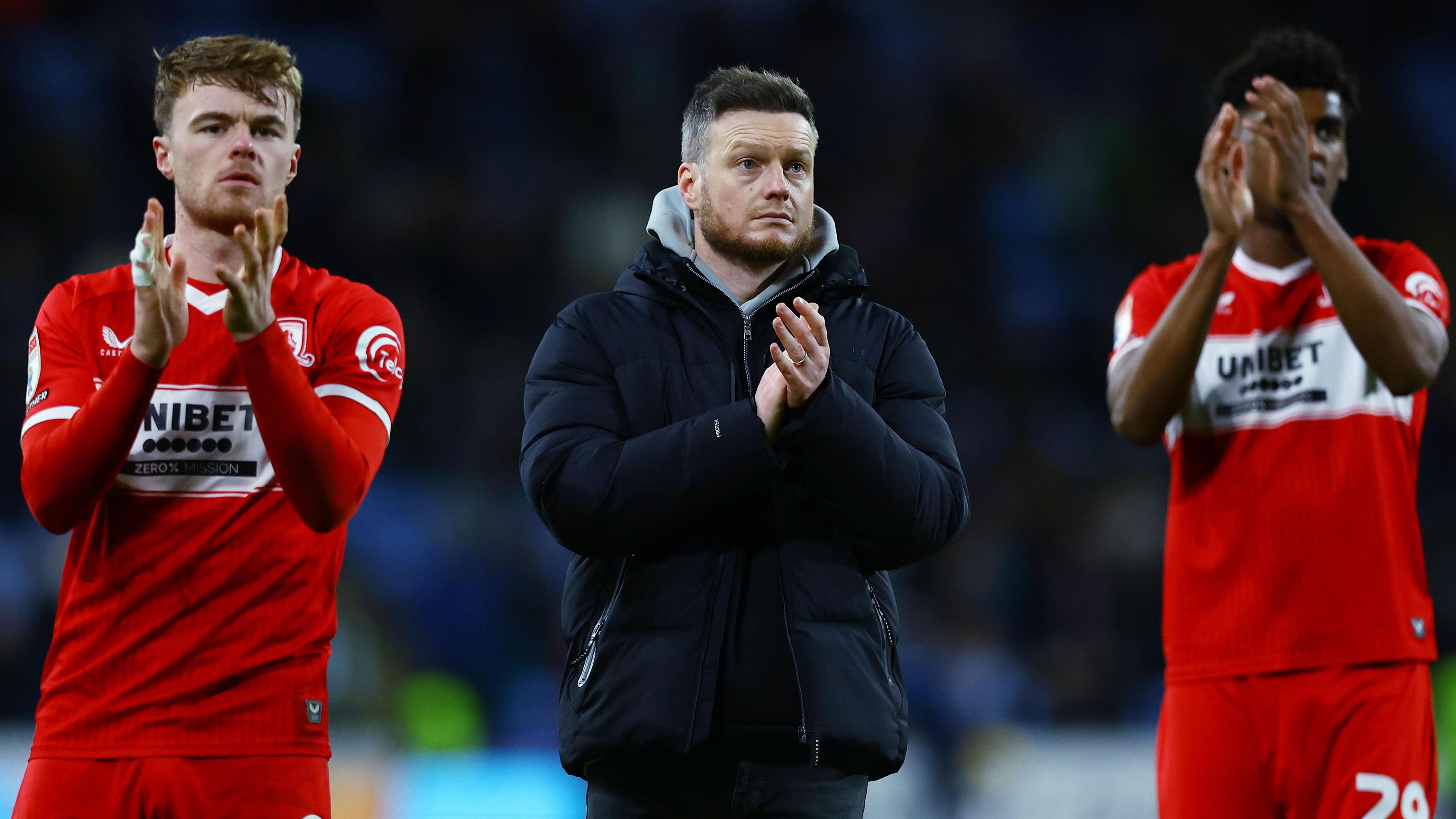 Middlesbrough head coach Kim Hellberg looks disappointed as he claps the away fans after defeat by Coventry City