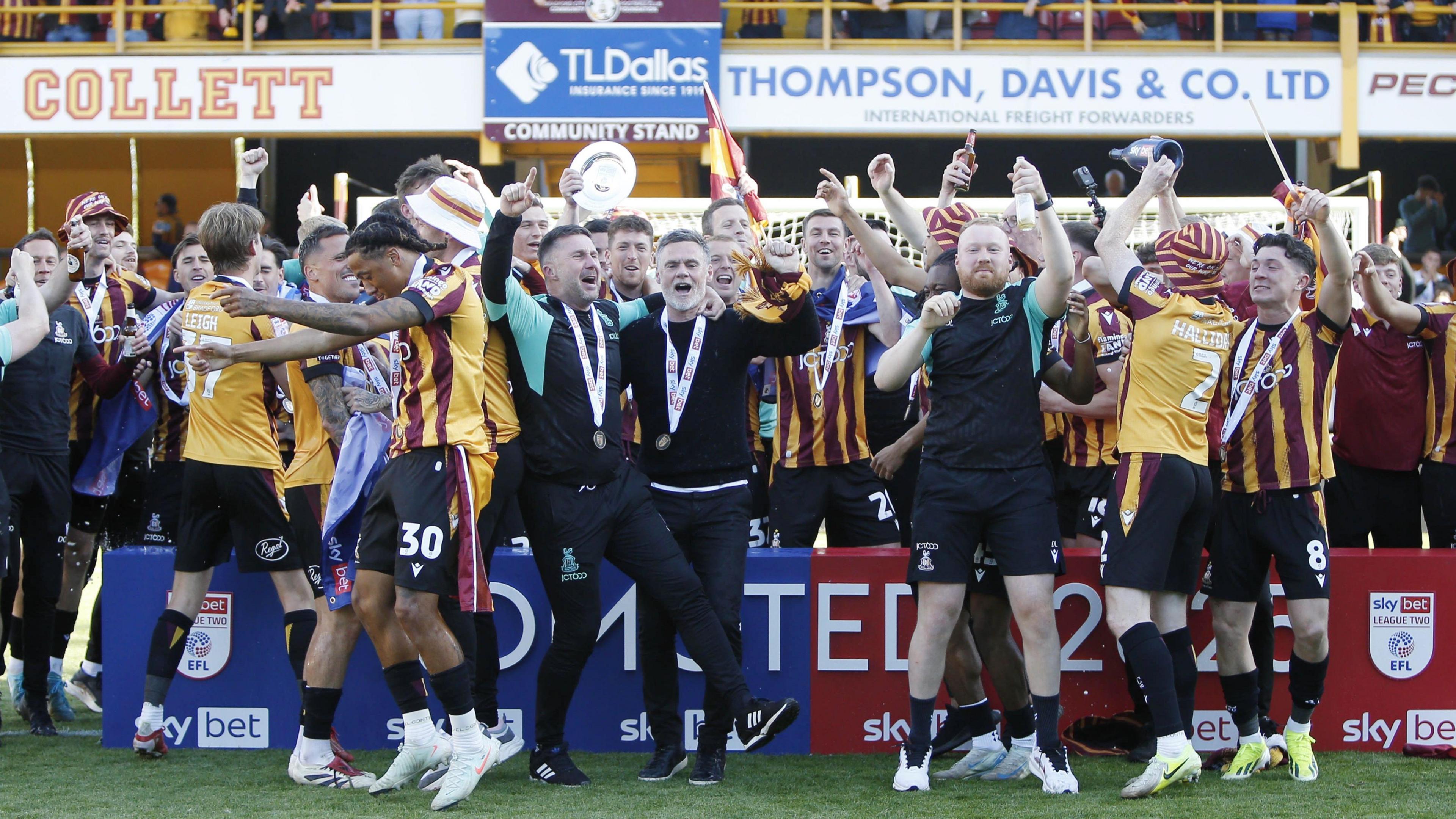 Bradford City players and manager celebrate after promotion