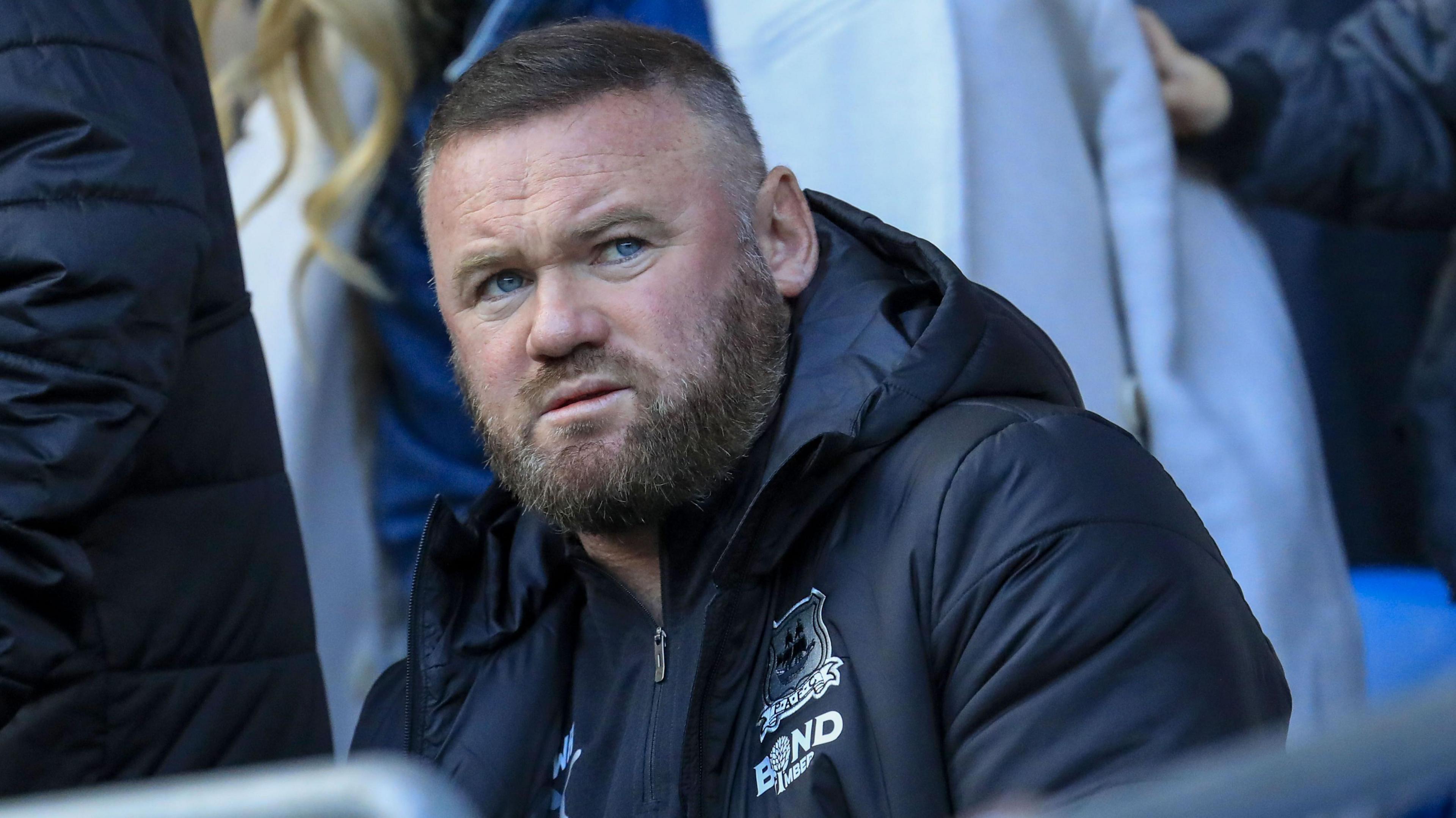 Wayne Rooney sat in the stands at Cardiff