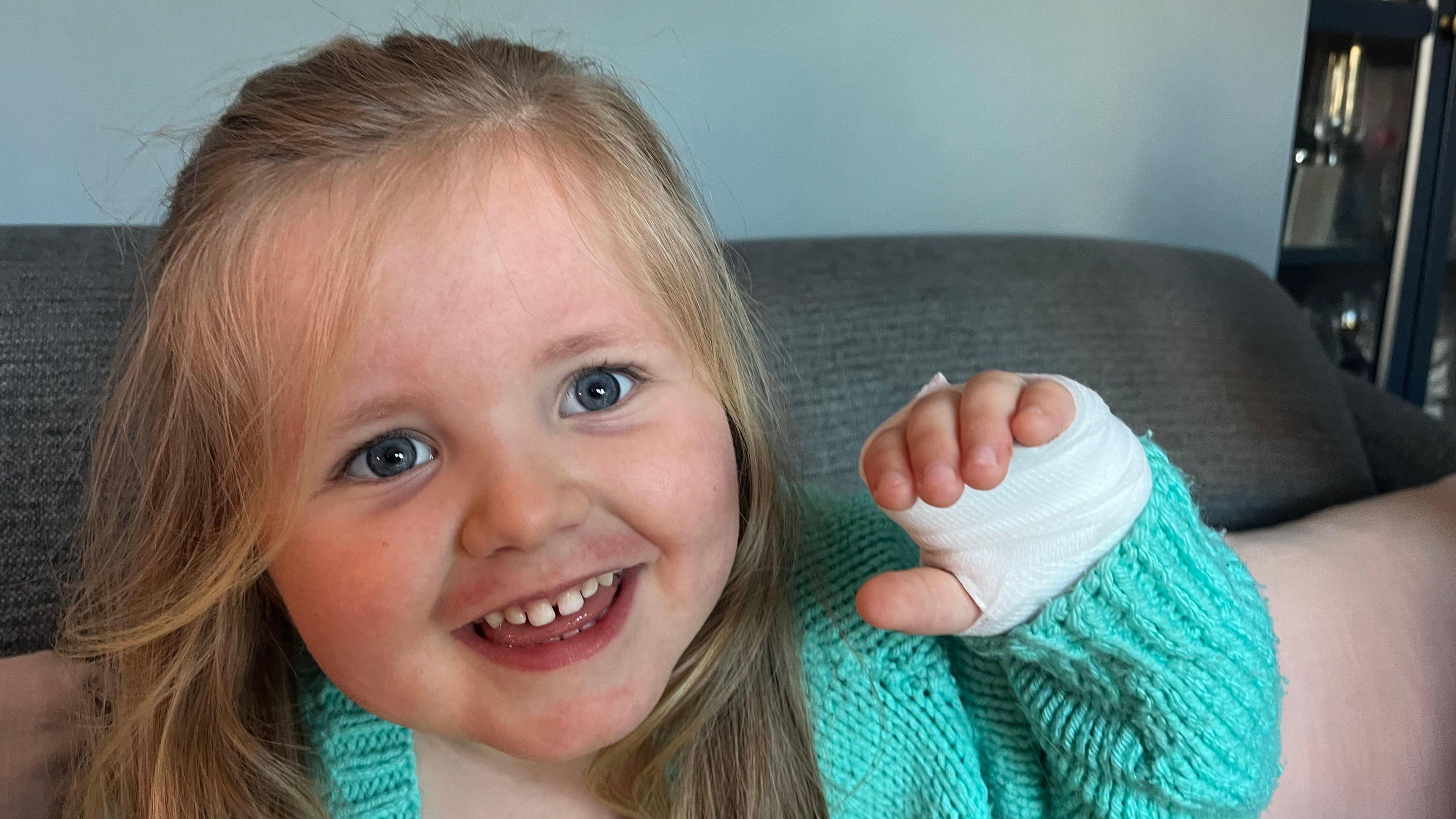 Ettie with a bandaged hand