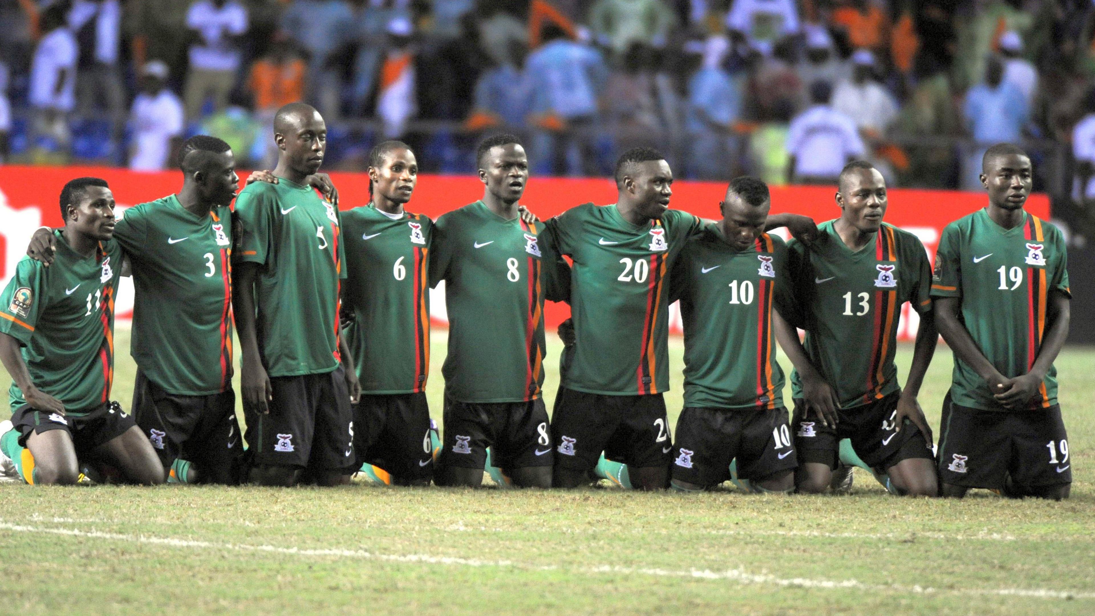 Zambia players kneel on the pitch during the penalty shoot-out to decide the outcome of the Africa Cup of Nations 