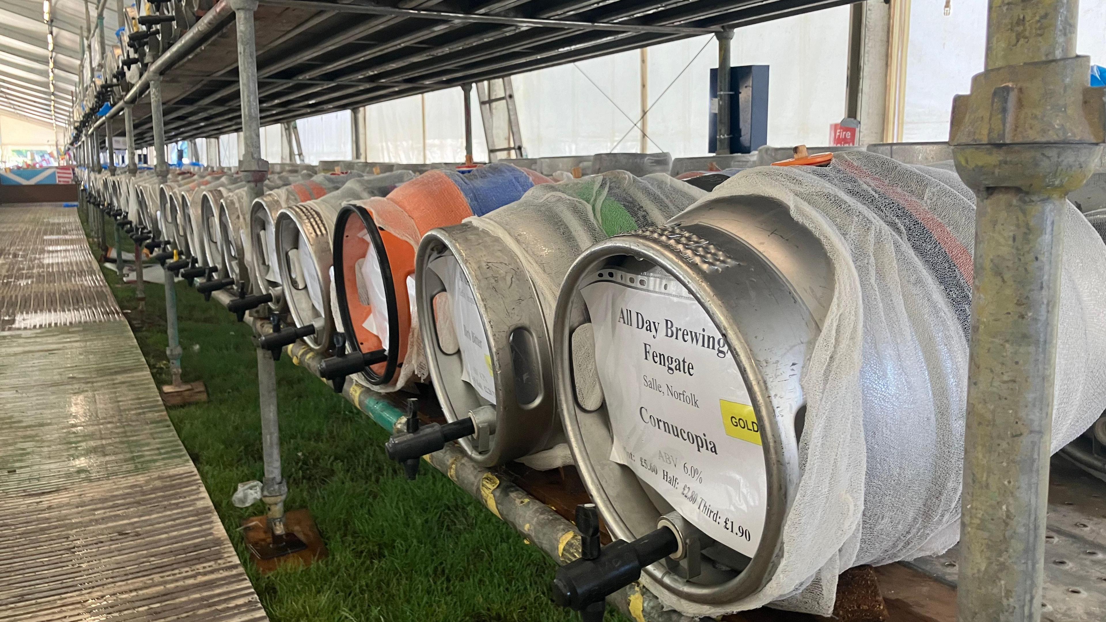 Barrels of beer stacked in rows at the venue 