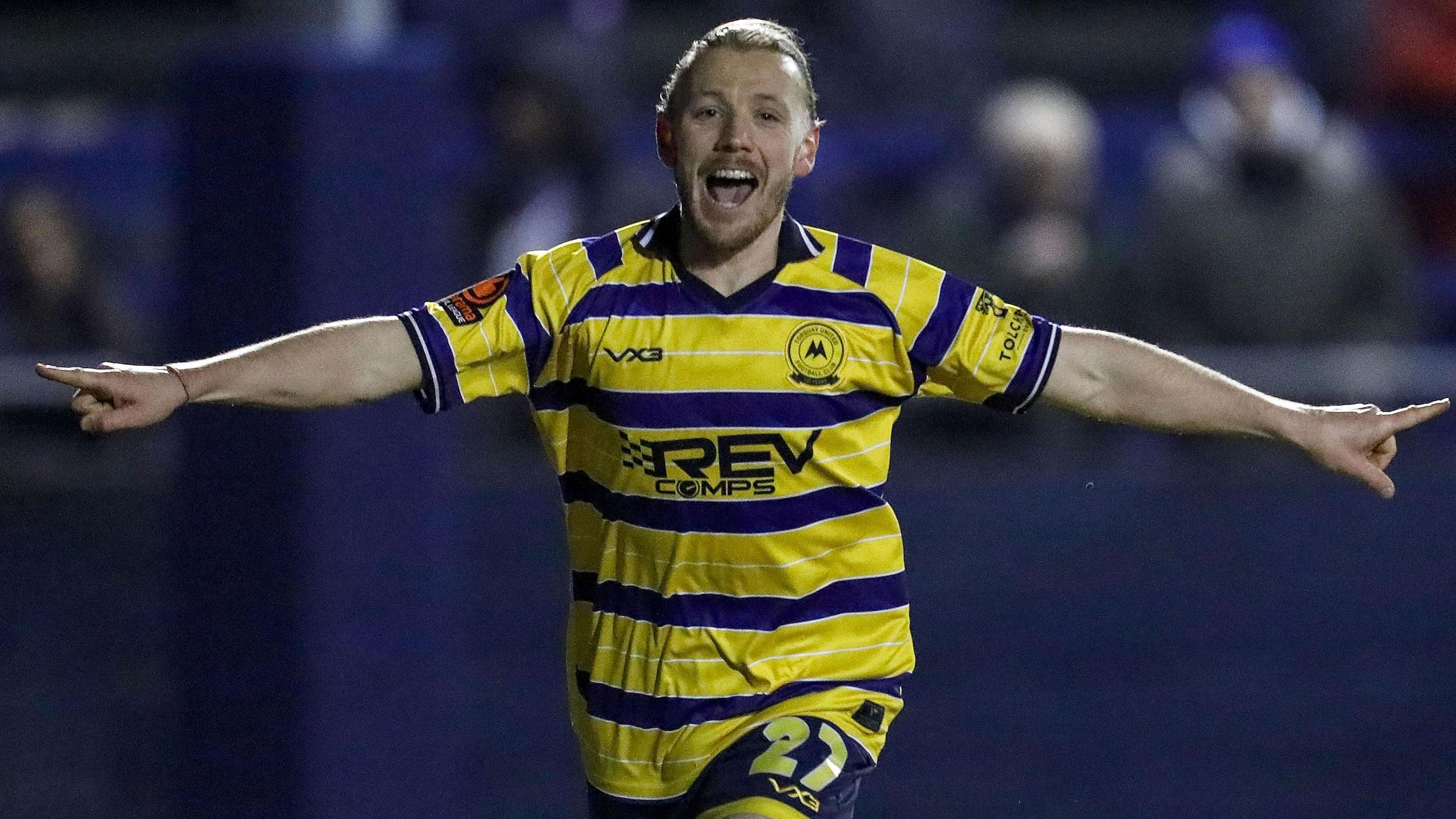 Matt Jay celebrates scoring for the fourth successive match for Torquay United