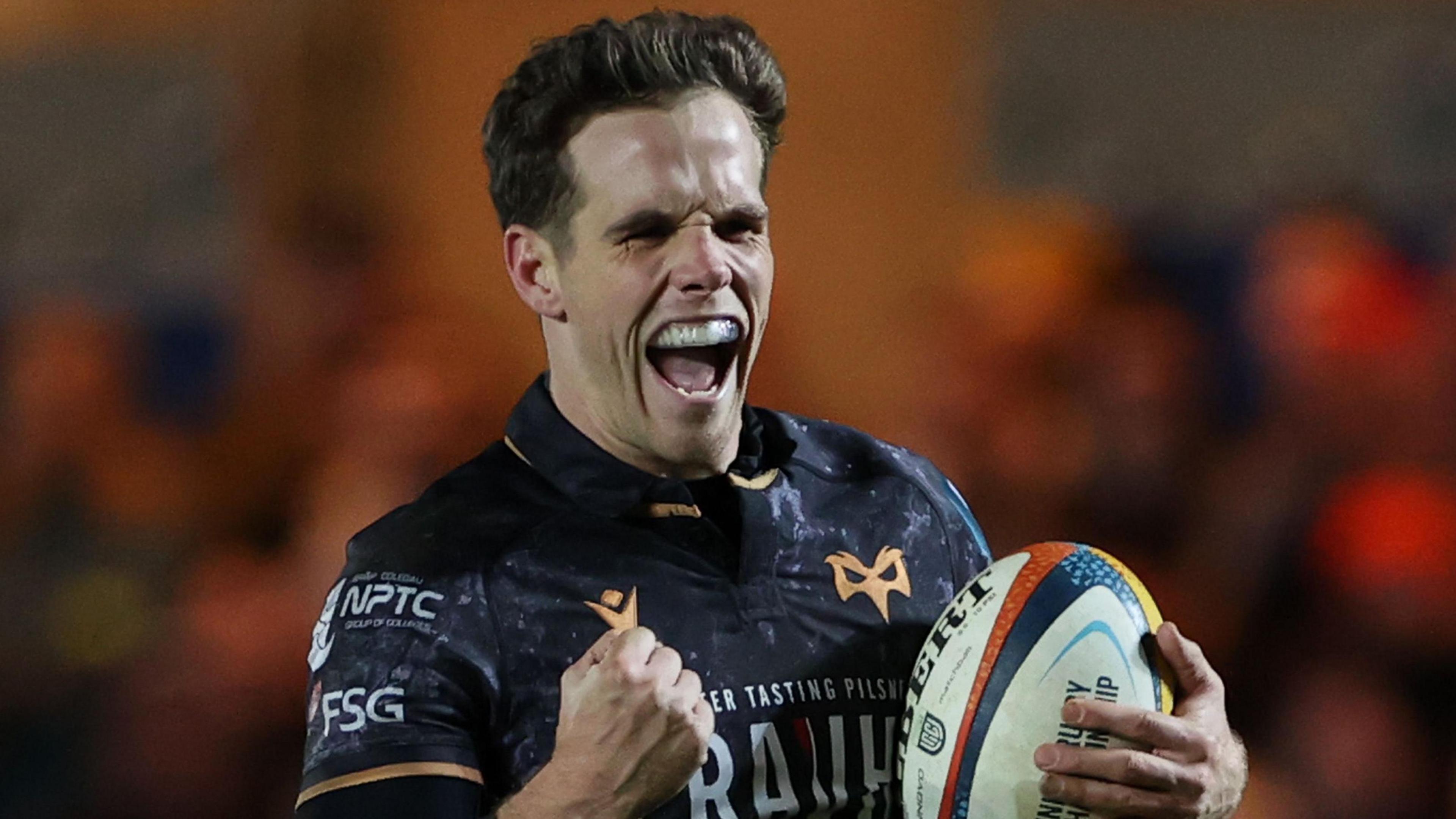 Ospreys scrum-half Kieran Hardy celebrate scoring a try