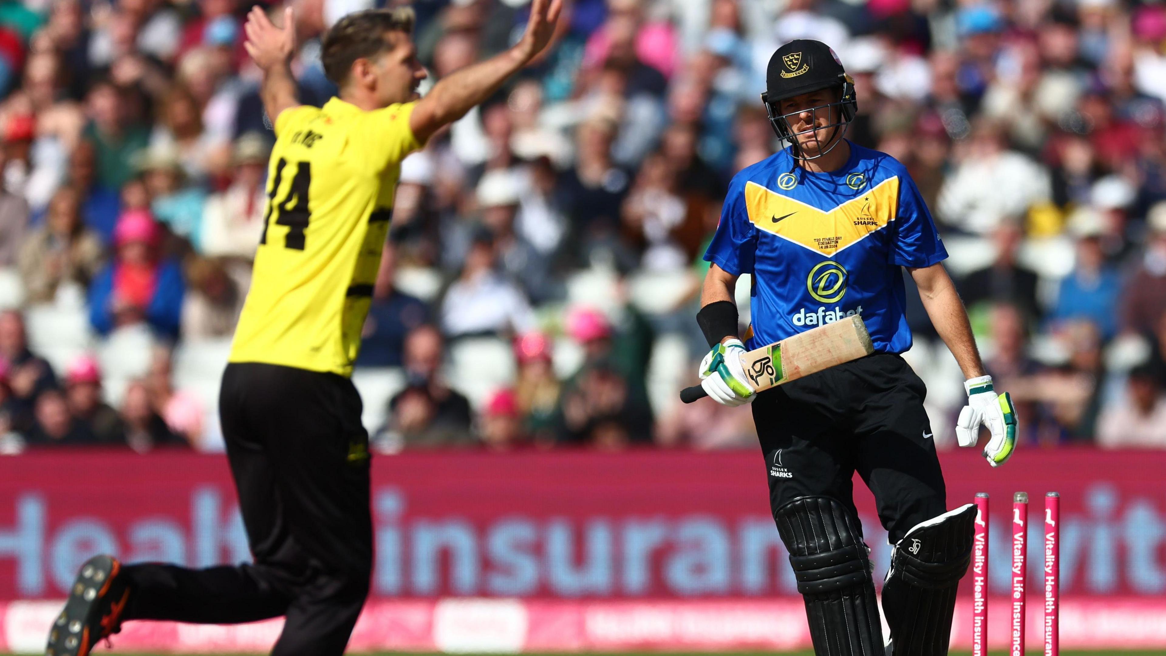 David Payne celebrates the wicket of Sussex's Australian danger man Daniel Hughes in the semi