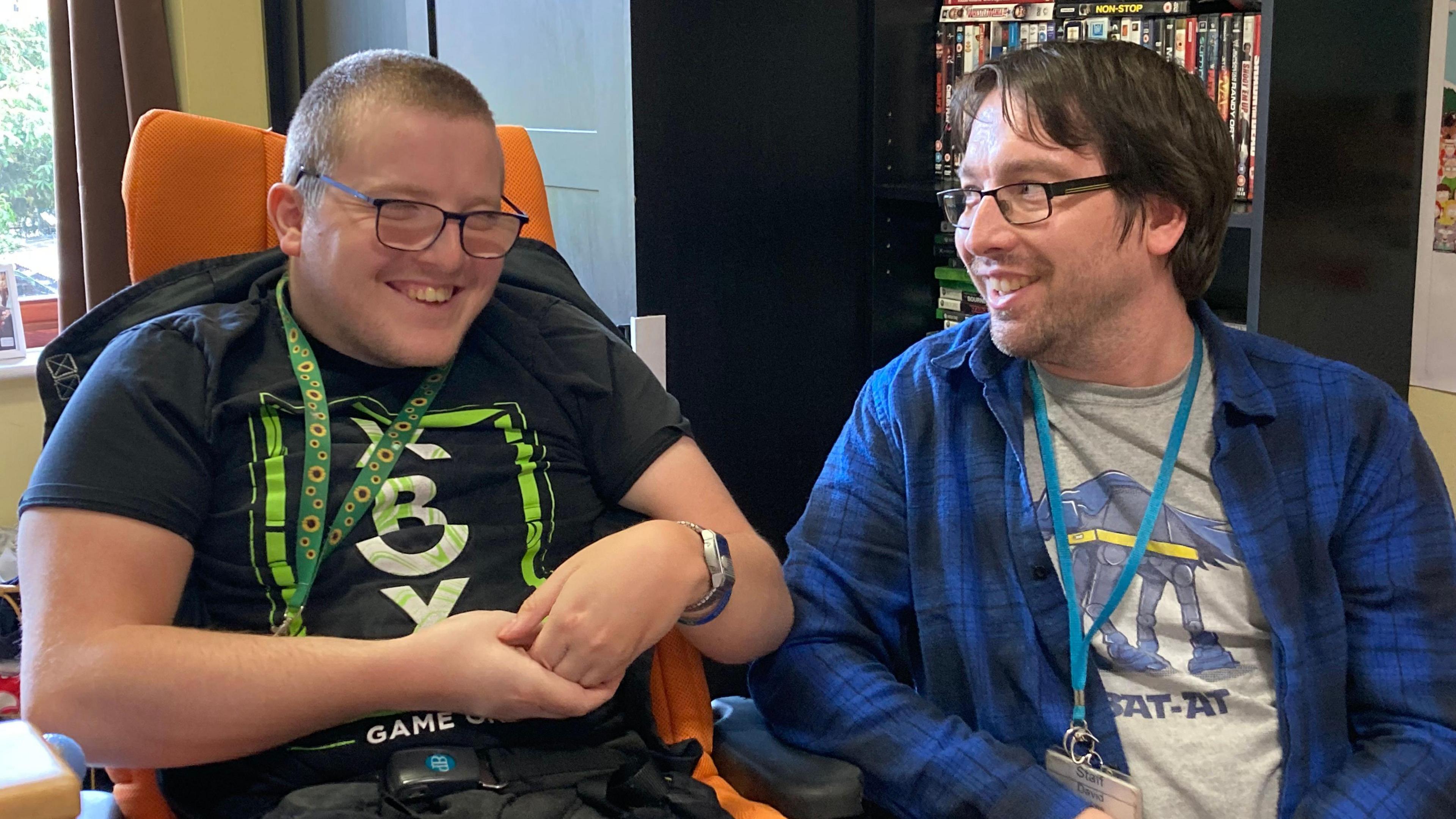 Xenon (left) and his carer David Stokes (right) laughing together in Xenon's room