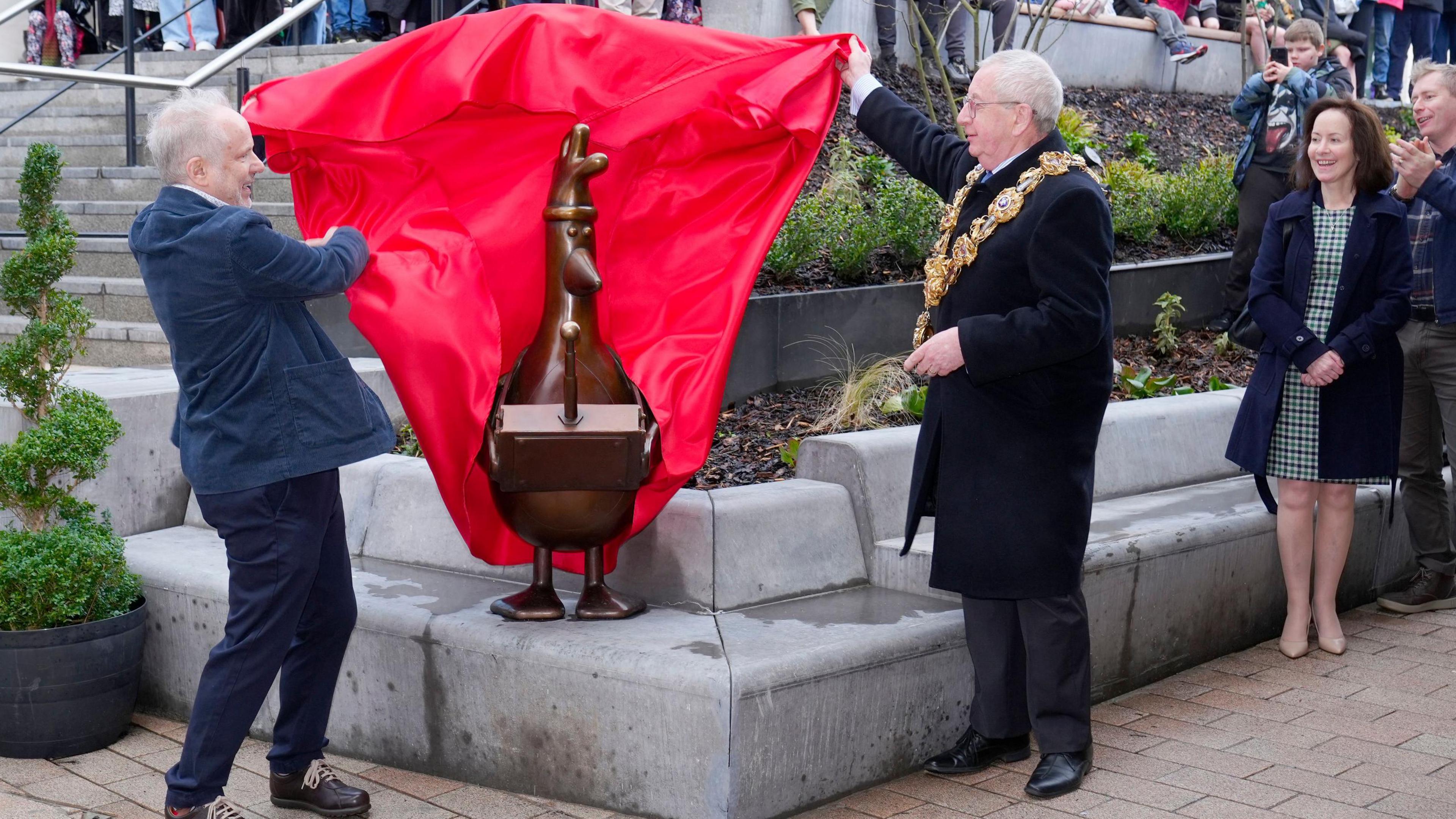 Wallace and Gromit creator Nick Park and the Mayor of Preston, Councillor Phil Crowe, unveil a statue of the animated character Feathers McGraw