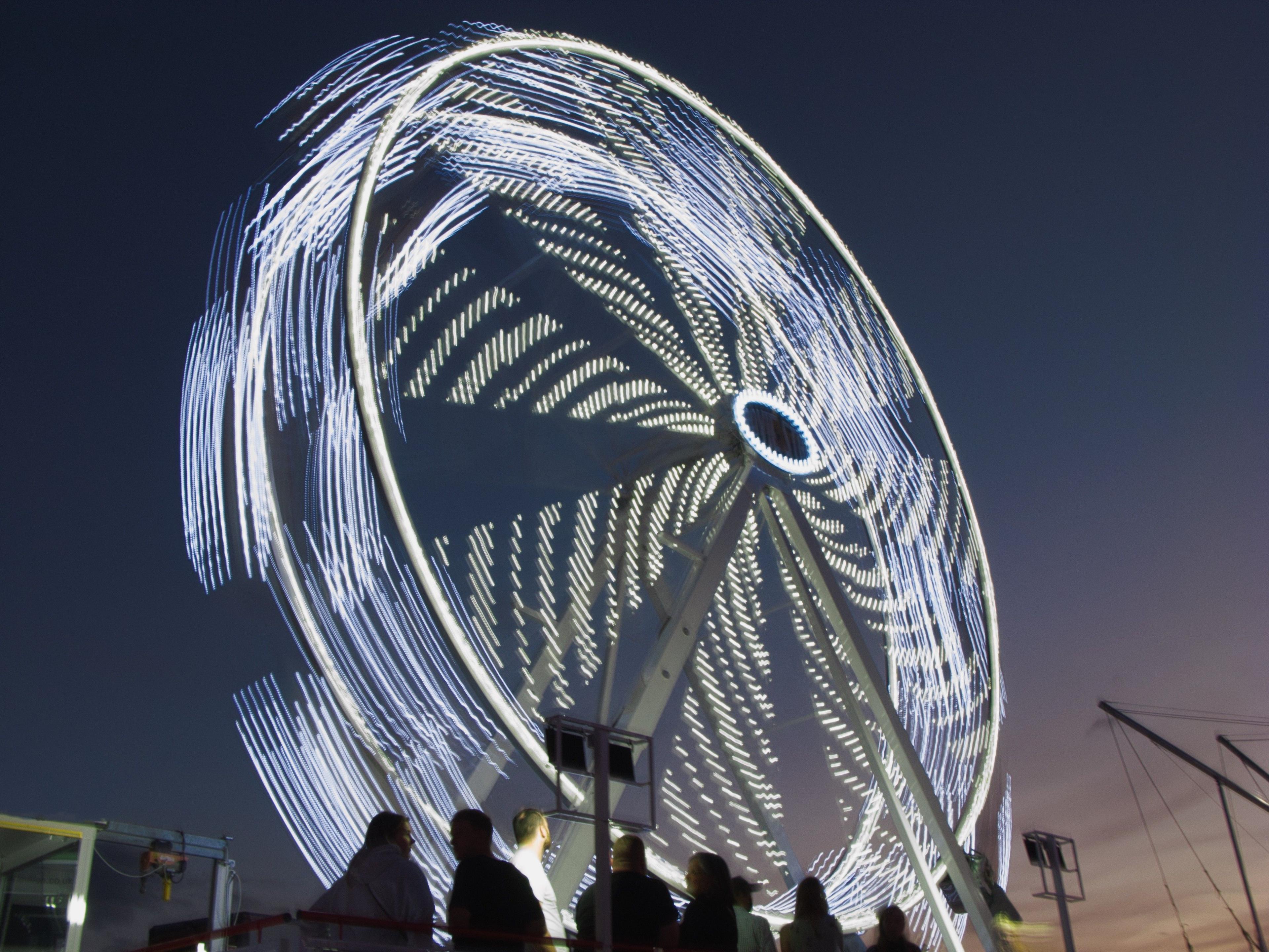 A big wheel lights up the sky