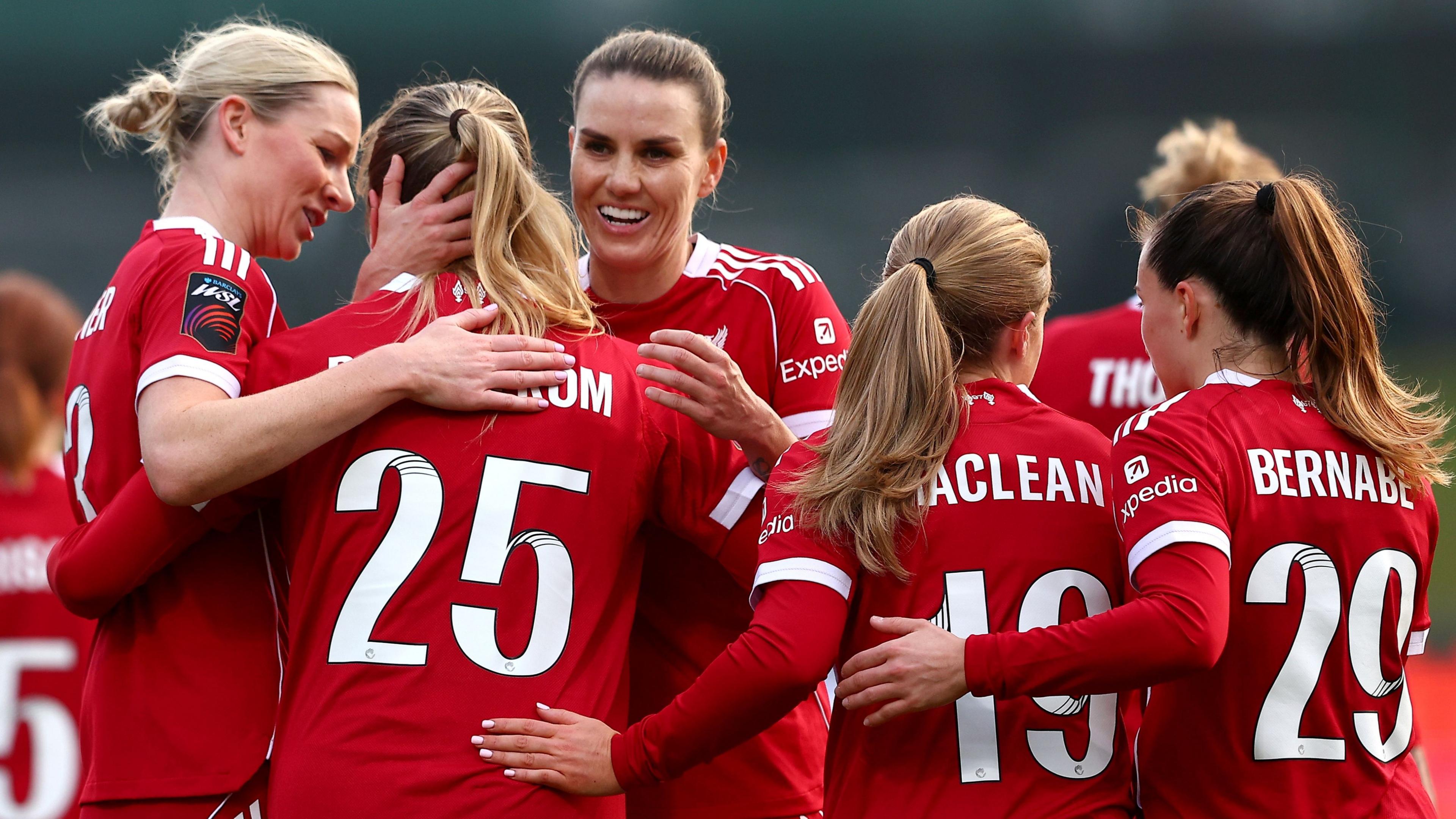 Alice Bergstrom of Liverpool celebrates scoring her team's sixth goal with teammates