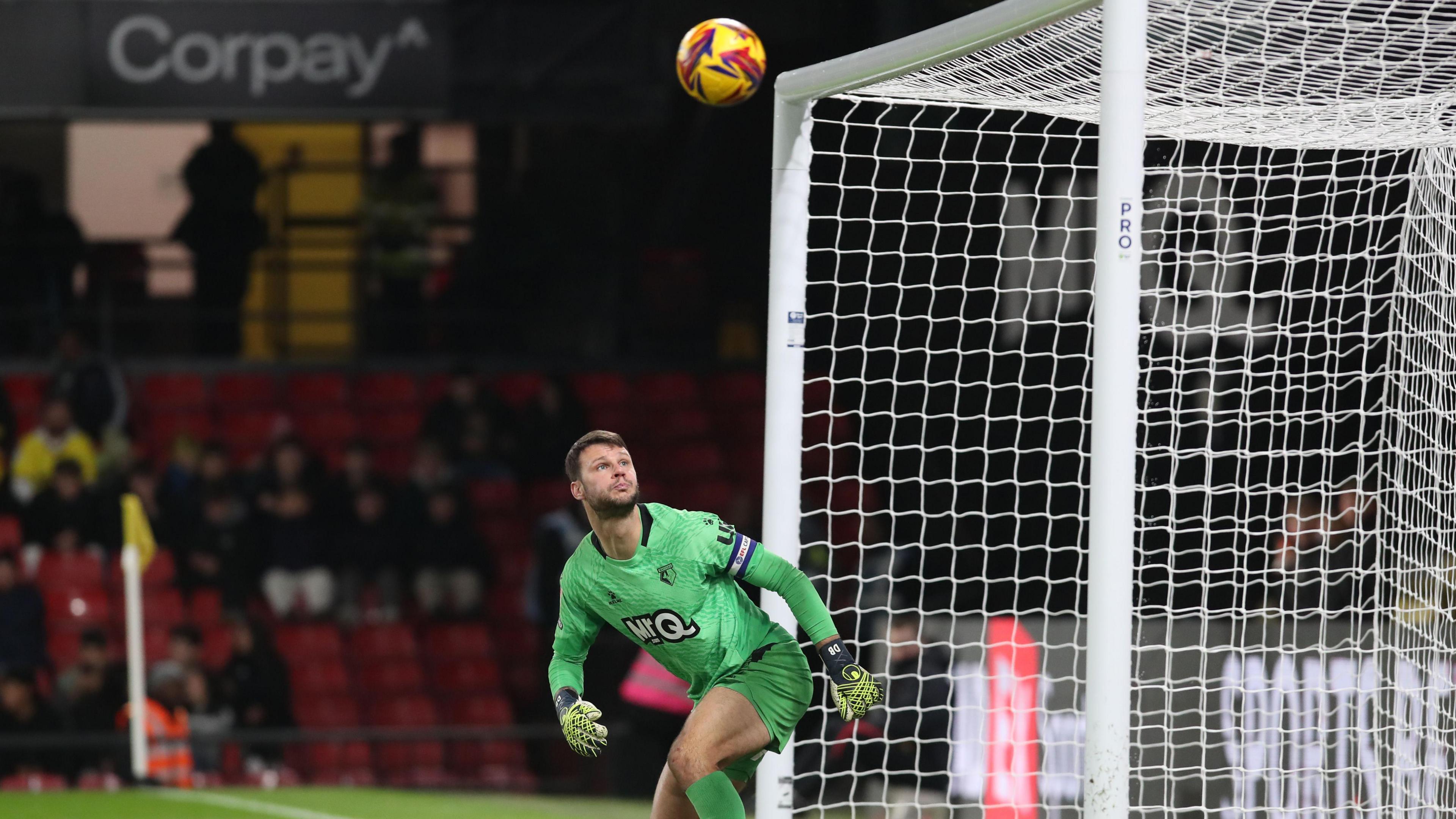 Watford keeper Daniel Bachmann can only watch as the ball is about to hit the bar against Bristol City