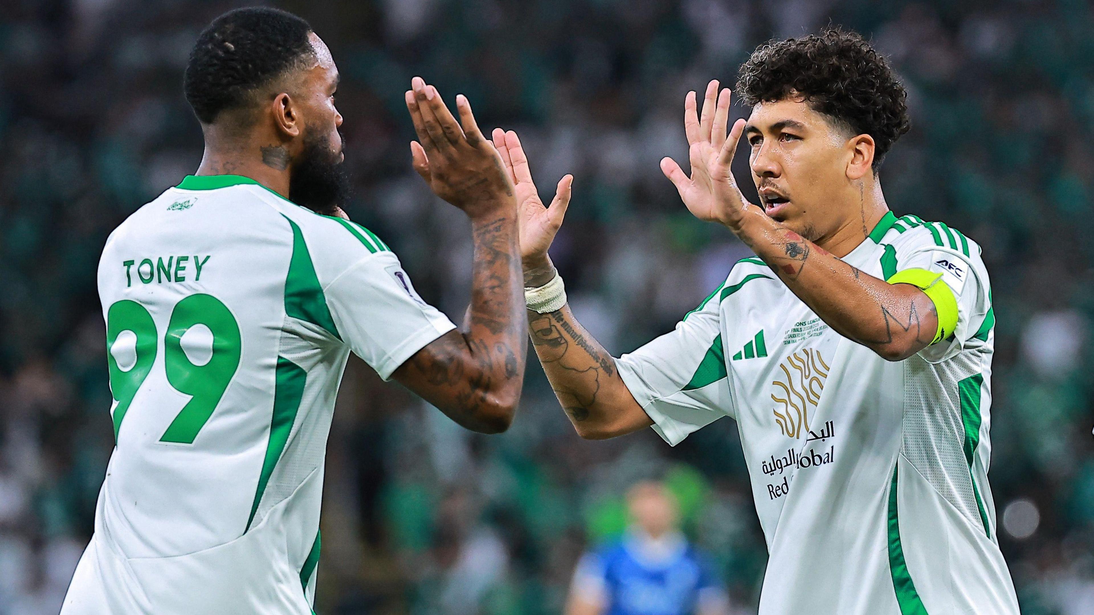 Ivan Toney celebrates alongside Roberto Firmino