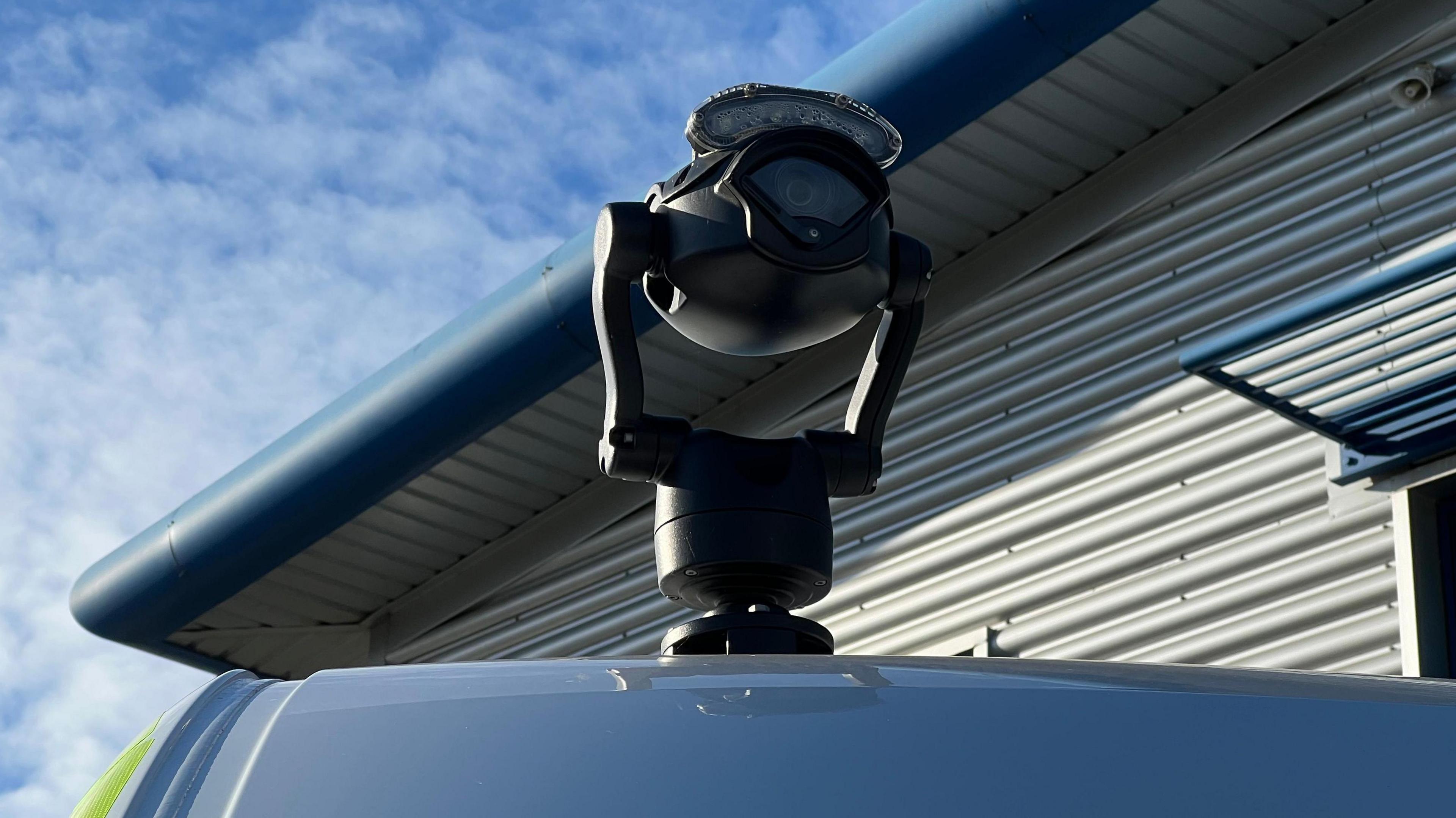 A live facial recognition camera mounted on top of a police van.
