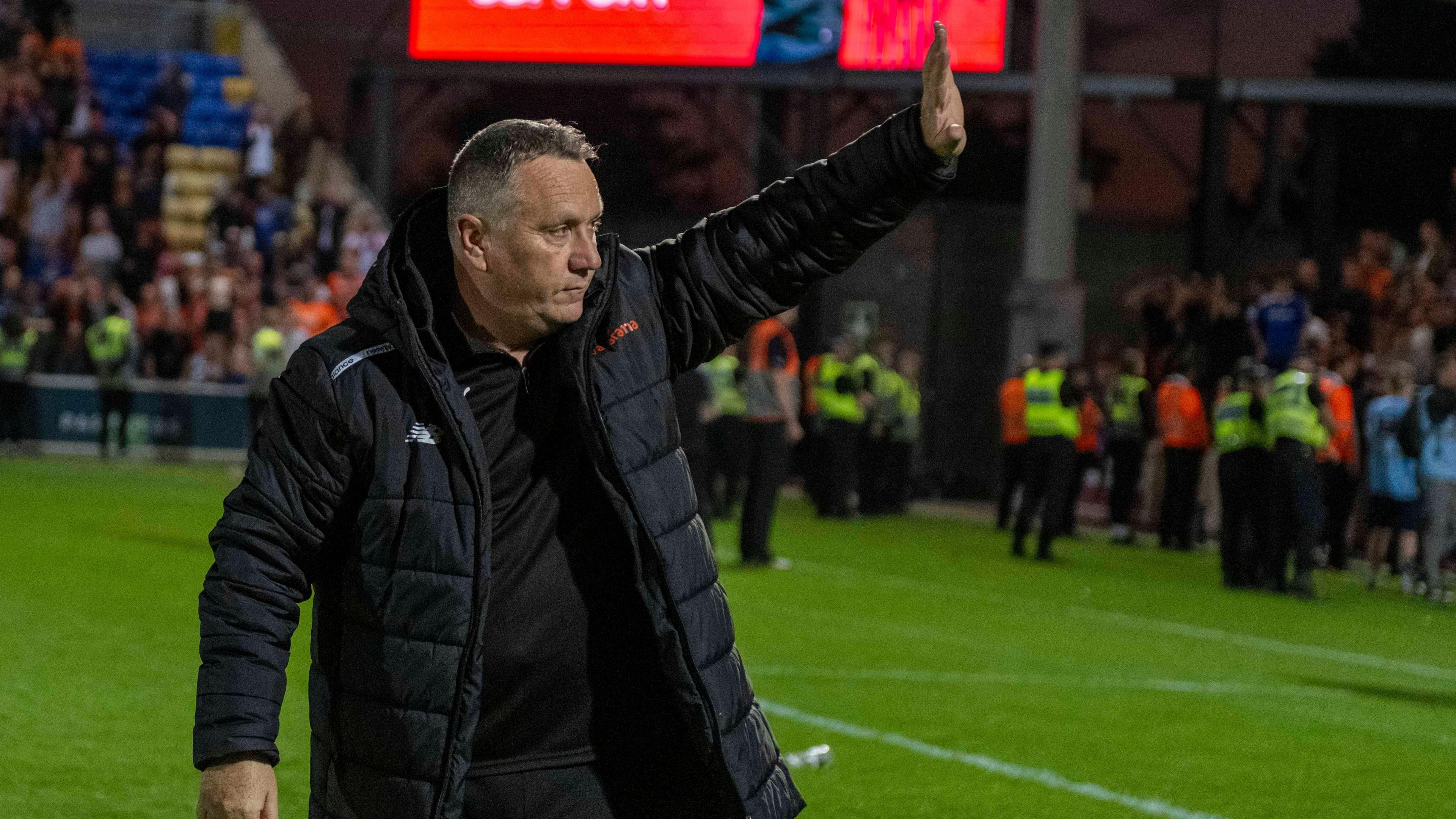 Micky Mellon waves to the Oldham Athletic supporters following their win against York City in the National League promotion play-off semi-final on Tuesday