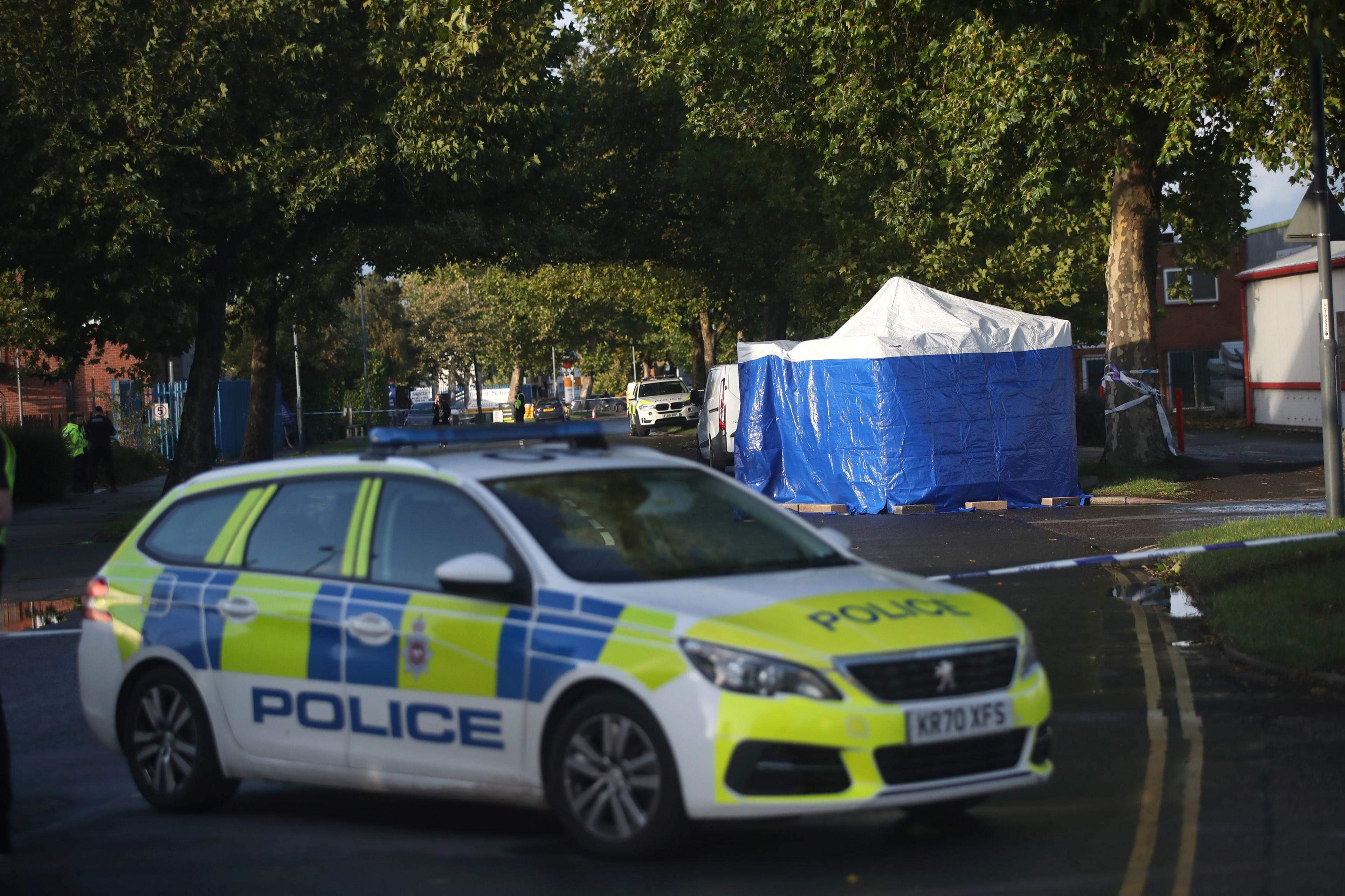 The scene outside Ascot Drive police station in Derby where a man was taken to hospital after being shot. 