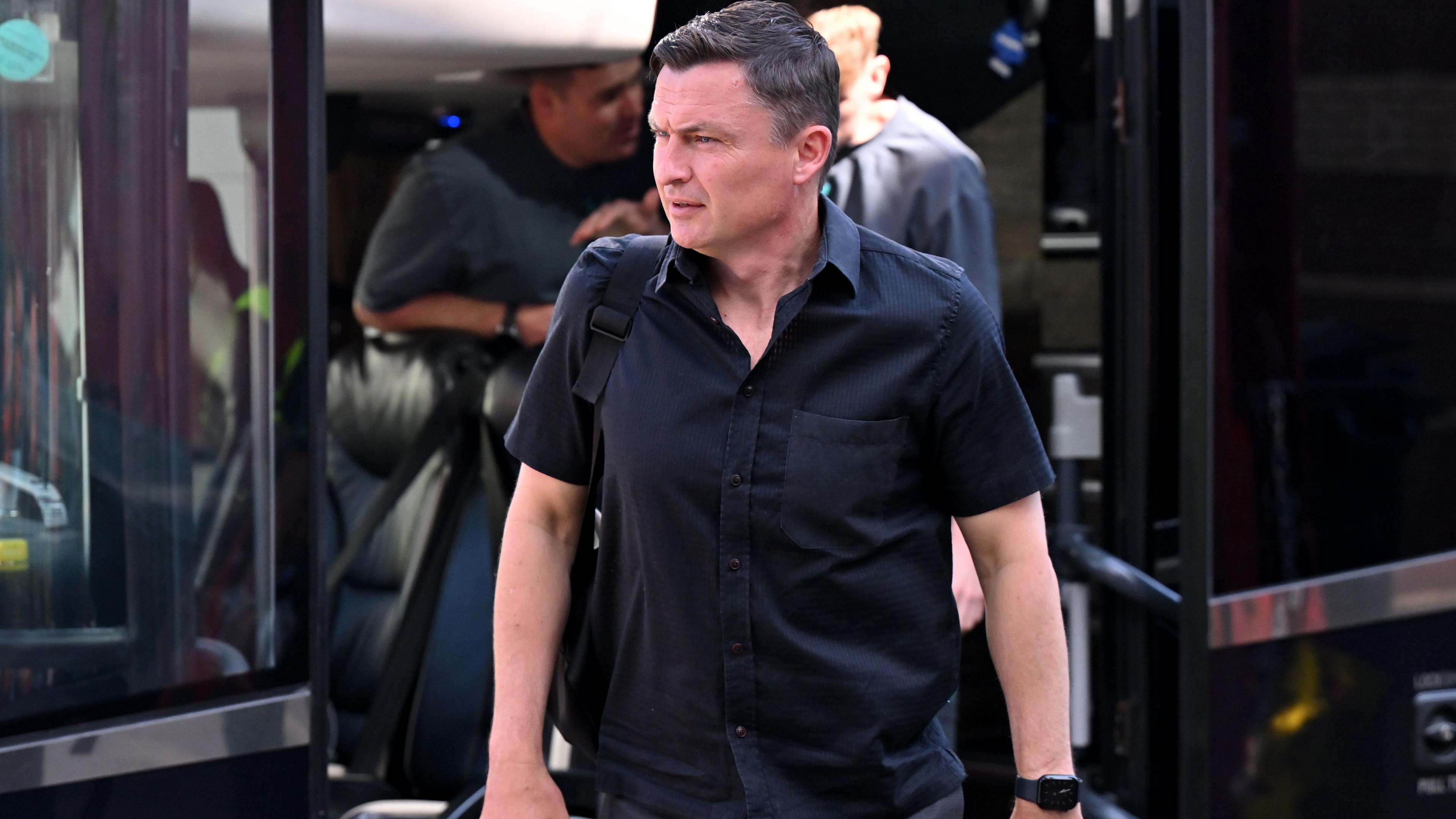 Paul Heckingbottom is pictured leaving the Preston team bus.