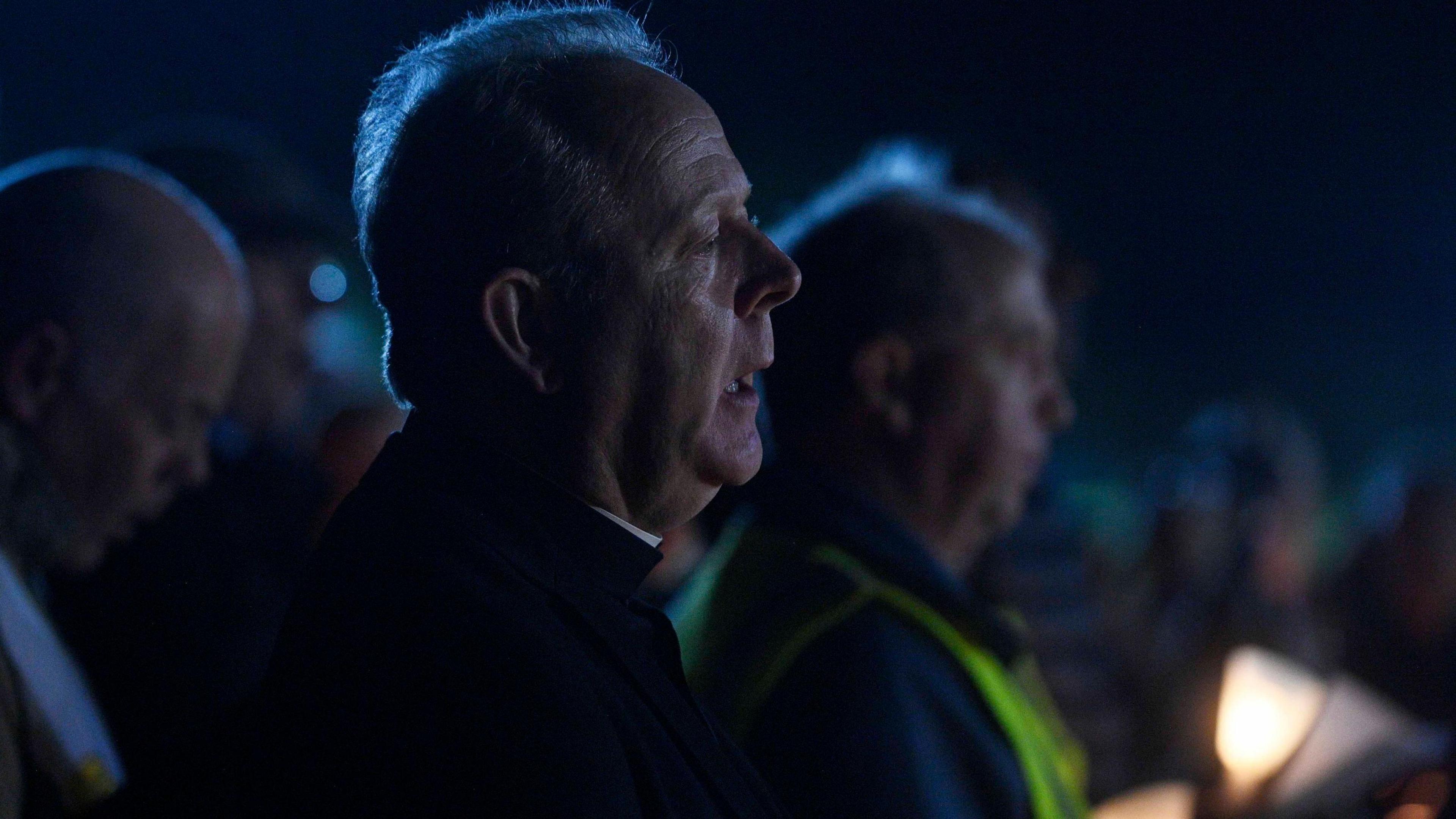 Eamon Martin side profile. It is dark.