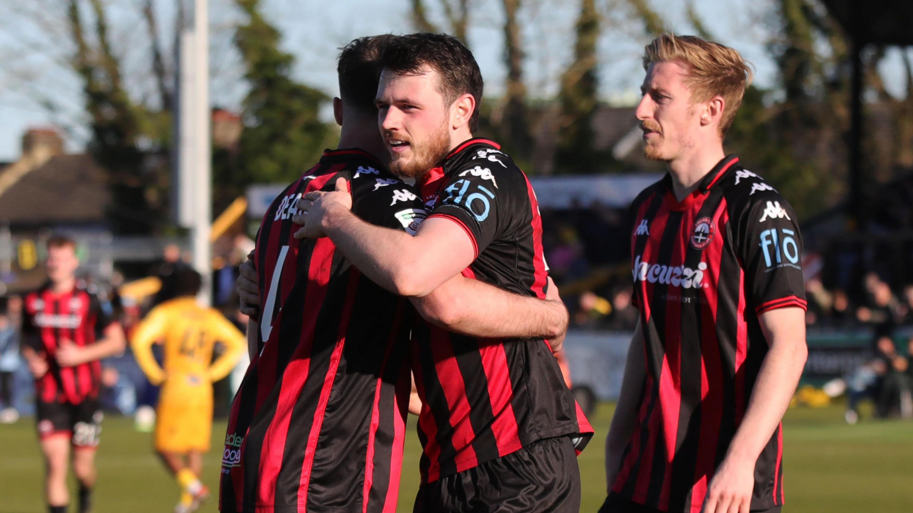 Truro City players celebrate a goal