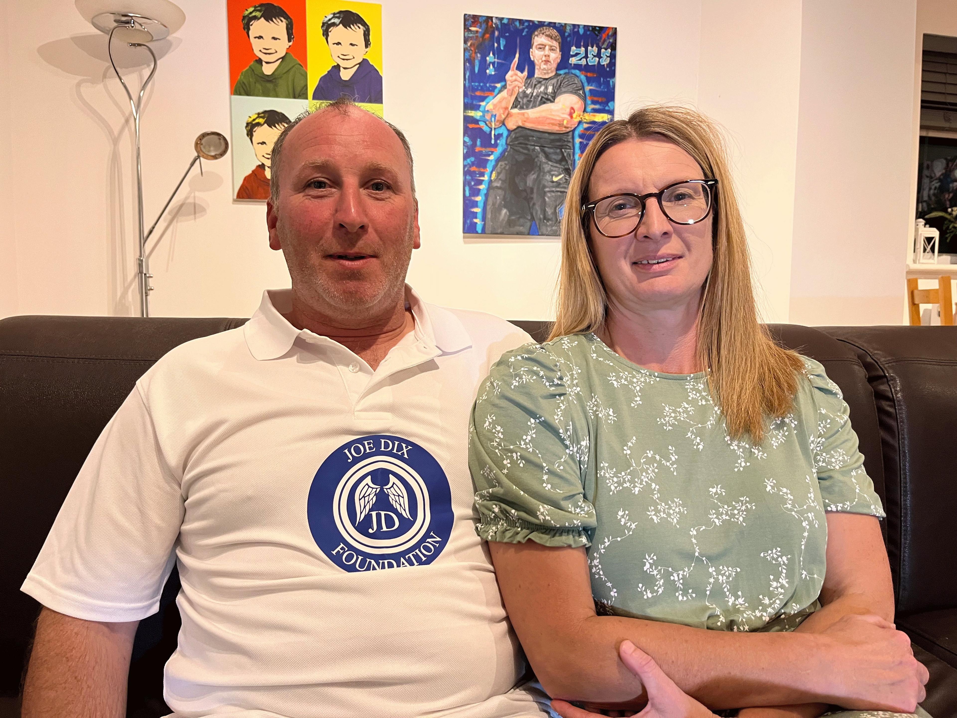 Phil Dix in a white top and his wife, Emma, in a light green top