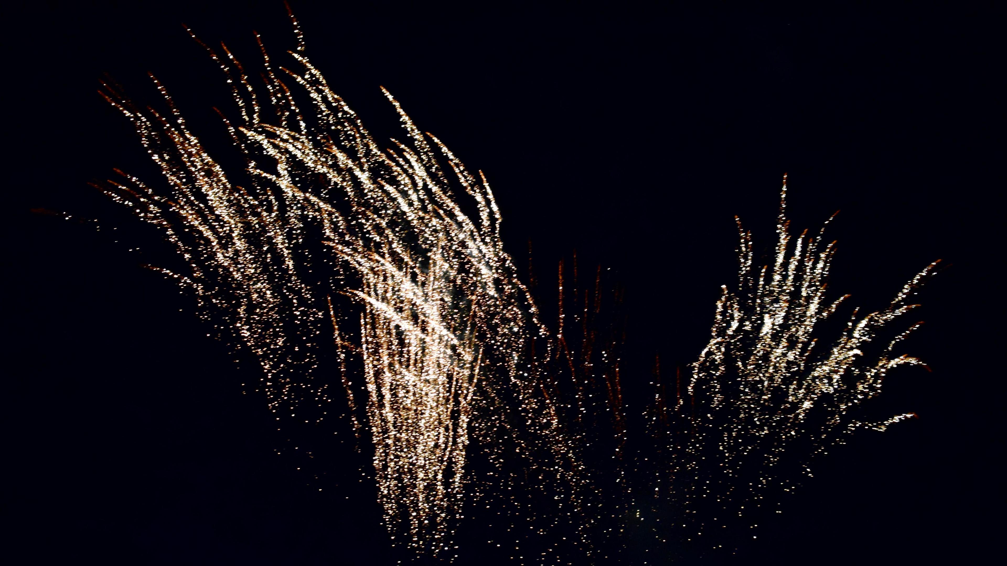 Library photograph of silver and golden fireworks exploding during Chinese New Year celebrations in Manchester's Chinatown on 10 February 2019.