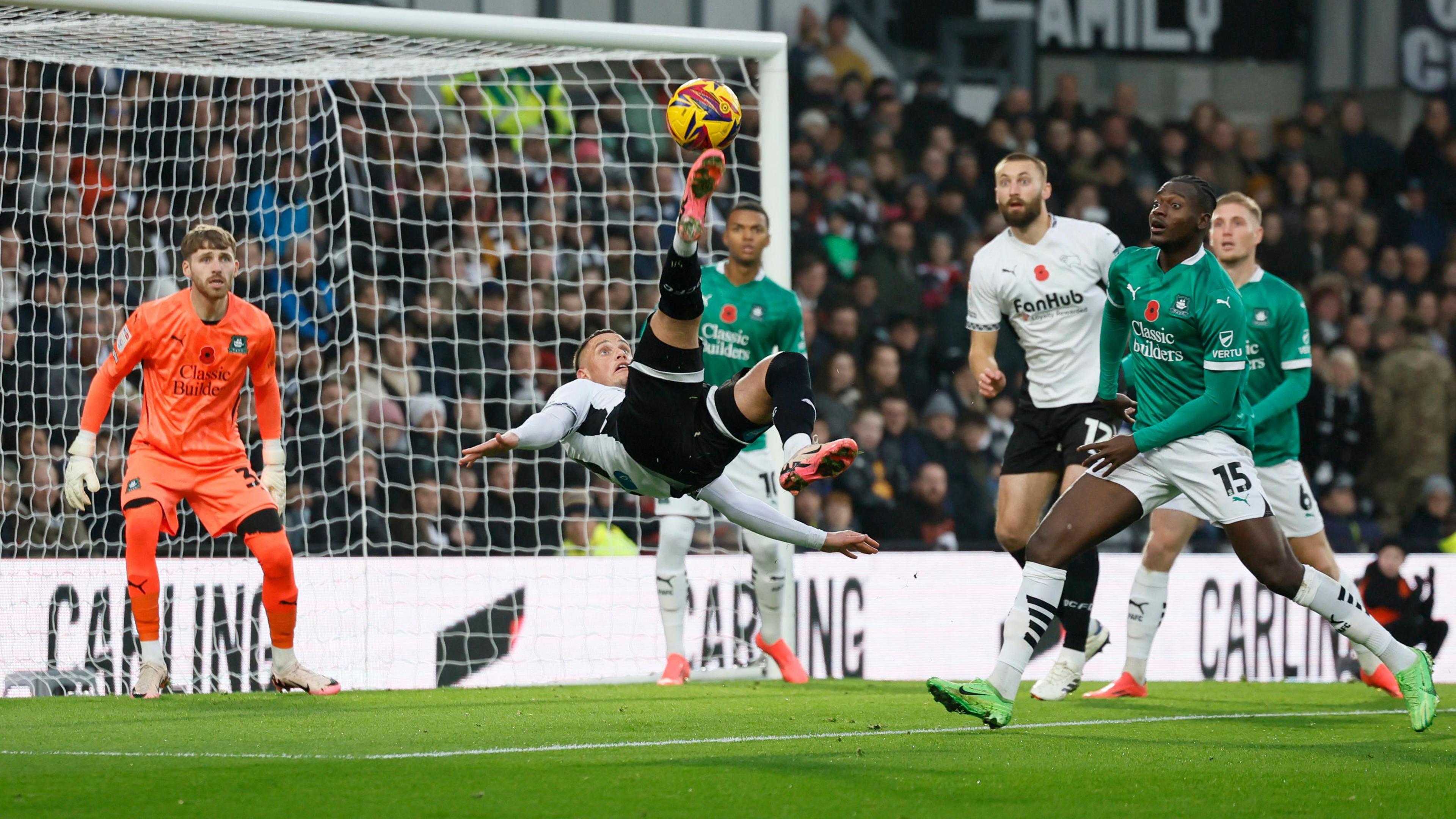 Derby's Jerry Yates scores a goal with an overhead kick against Plymouth