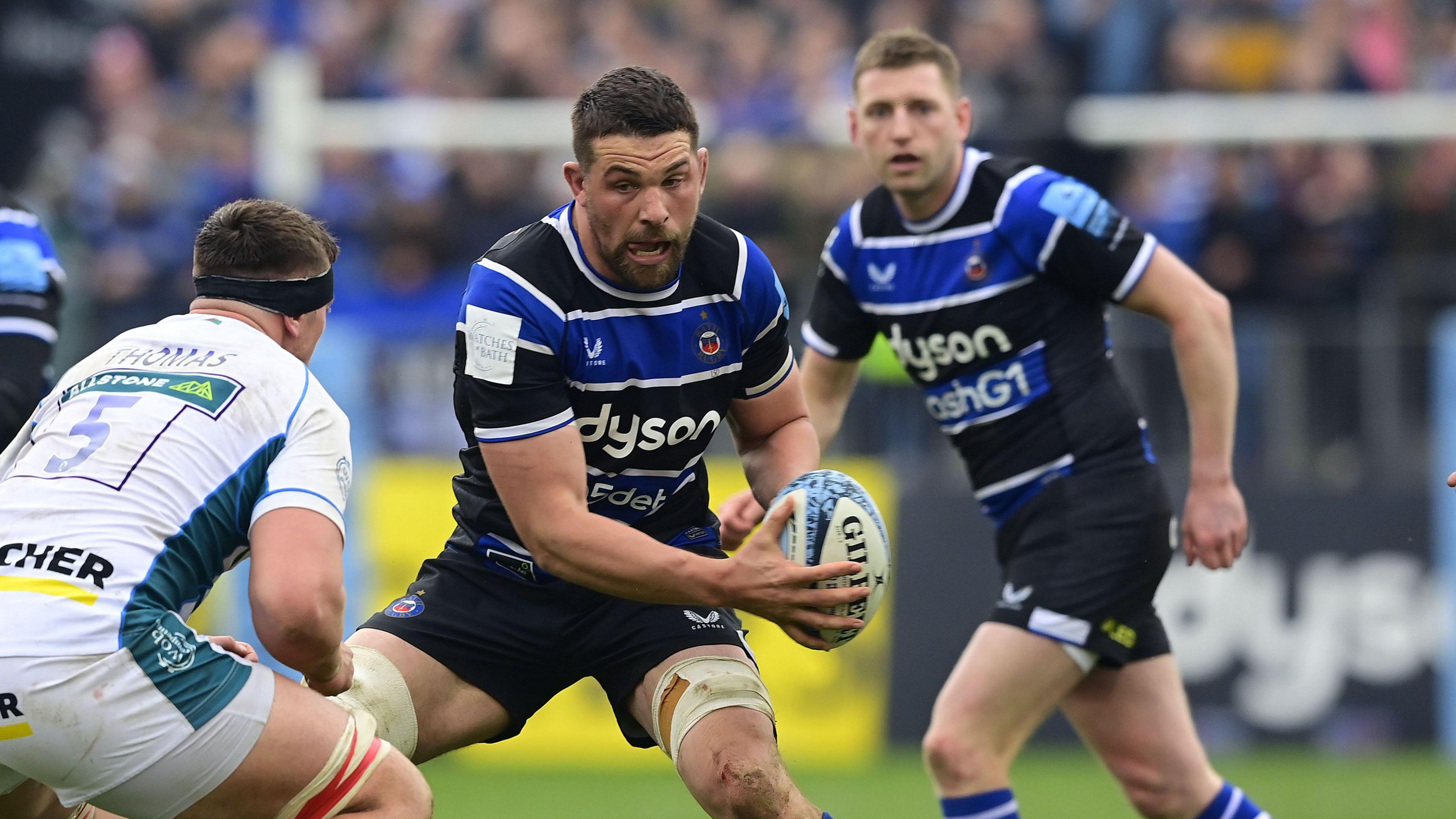 Charlie Ewels (centre) with the ball going into a tackle