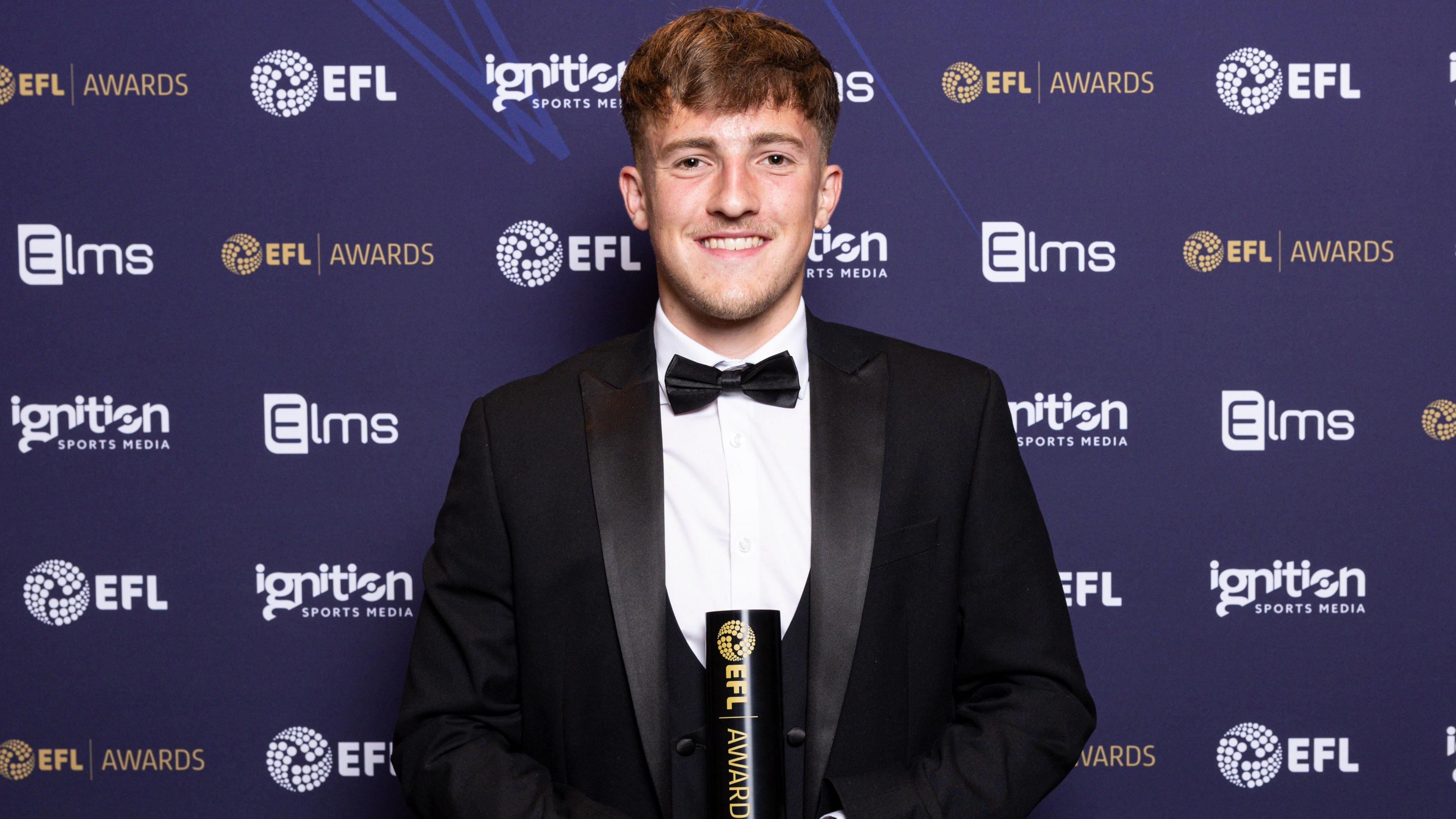 Jake Richards poses with his award