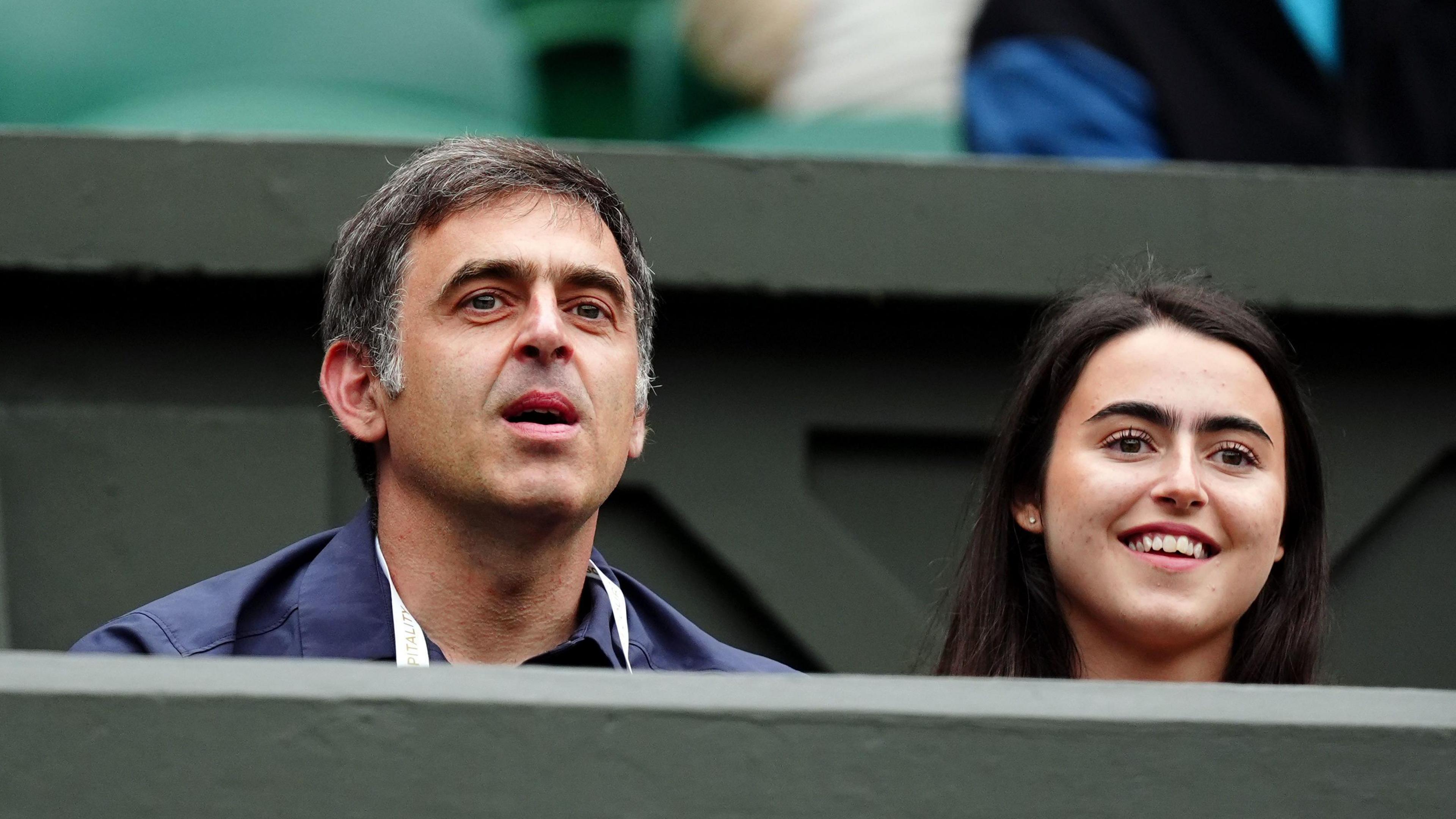 Ronnie O'Sullivan watches Novak Djokovic's match on Centre Court