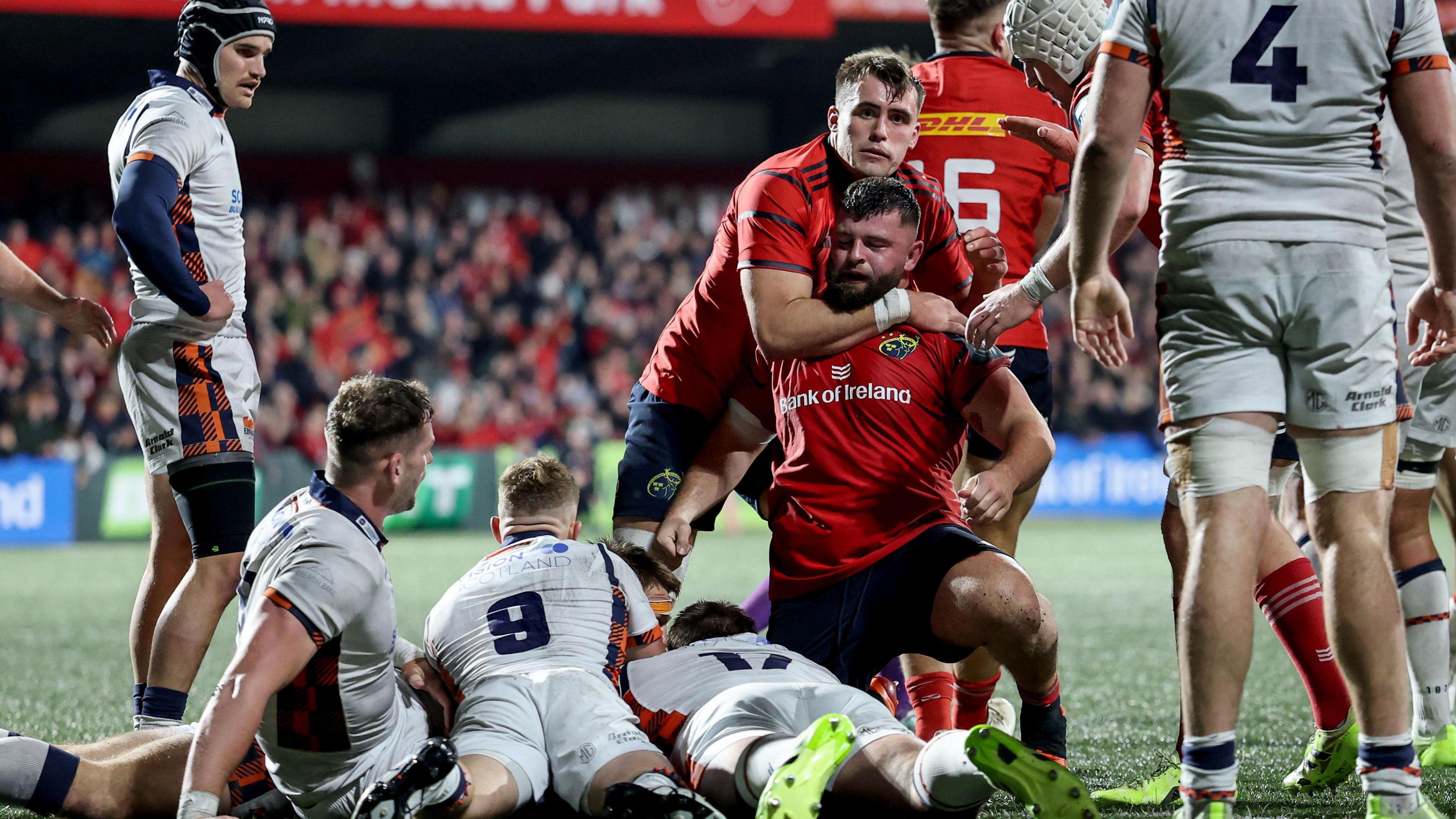 Munster's Michael Milne celebrates after scoring a try against Edinburgh