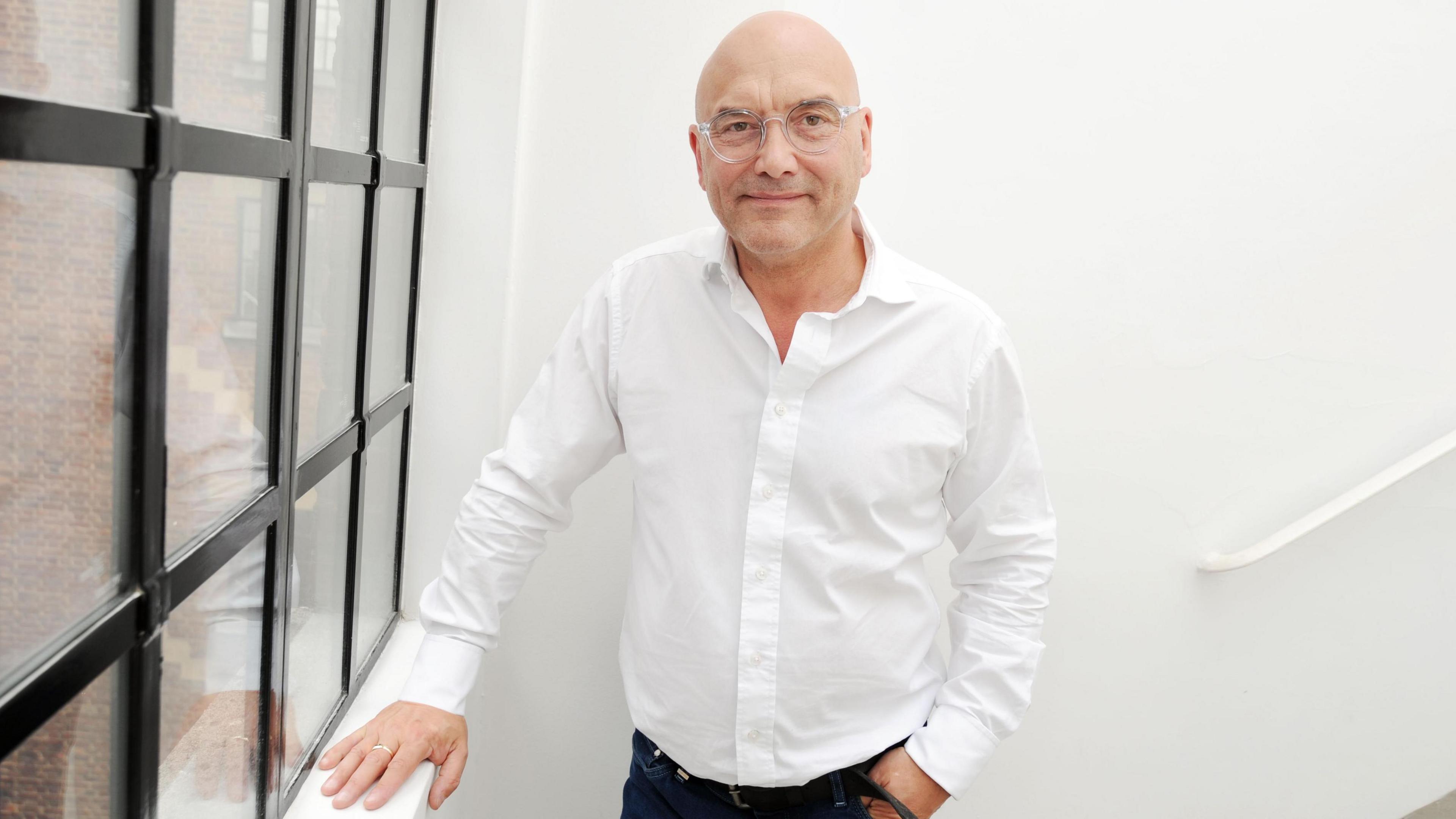 Gregg Wallace pictured at Radio 2 in 2019, standing on a staircase