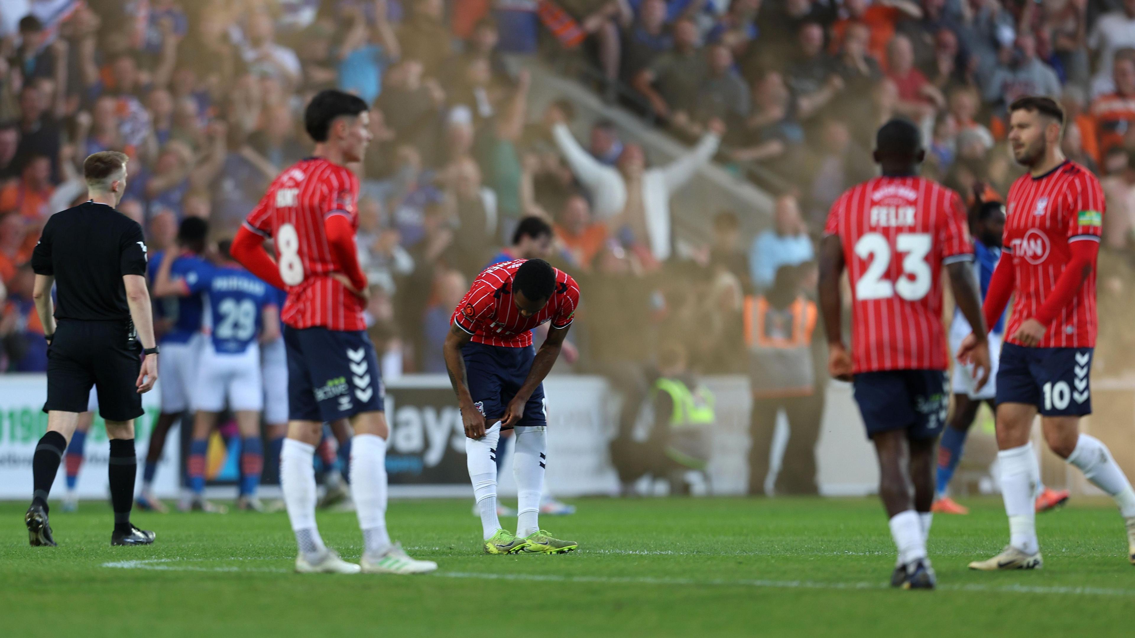 York City players look dejected arsenic Oldham Athletic observe winning nan National League play-off semi last successful May 2025
