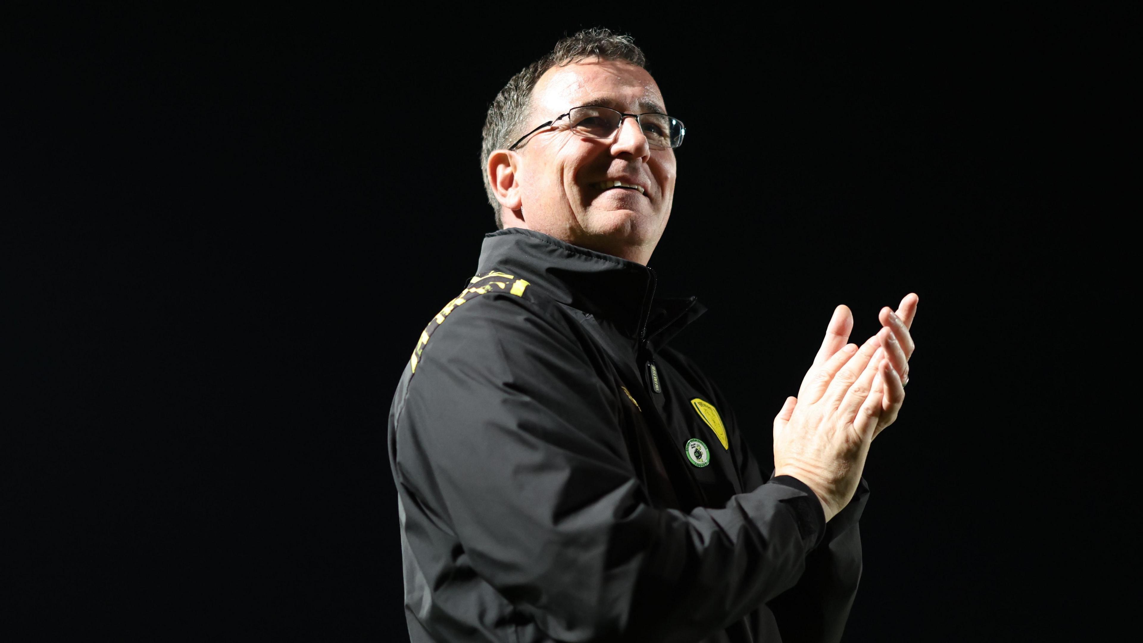 Burton boss Gary Bowyer applauding supporters