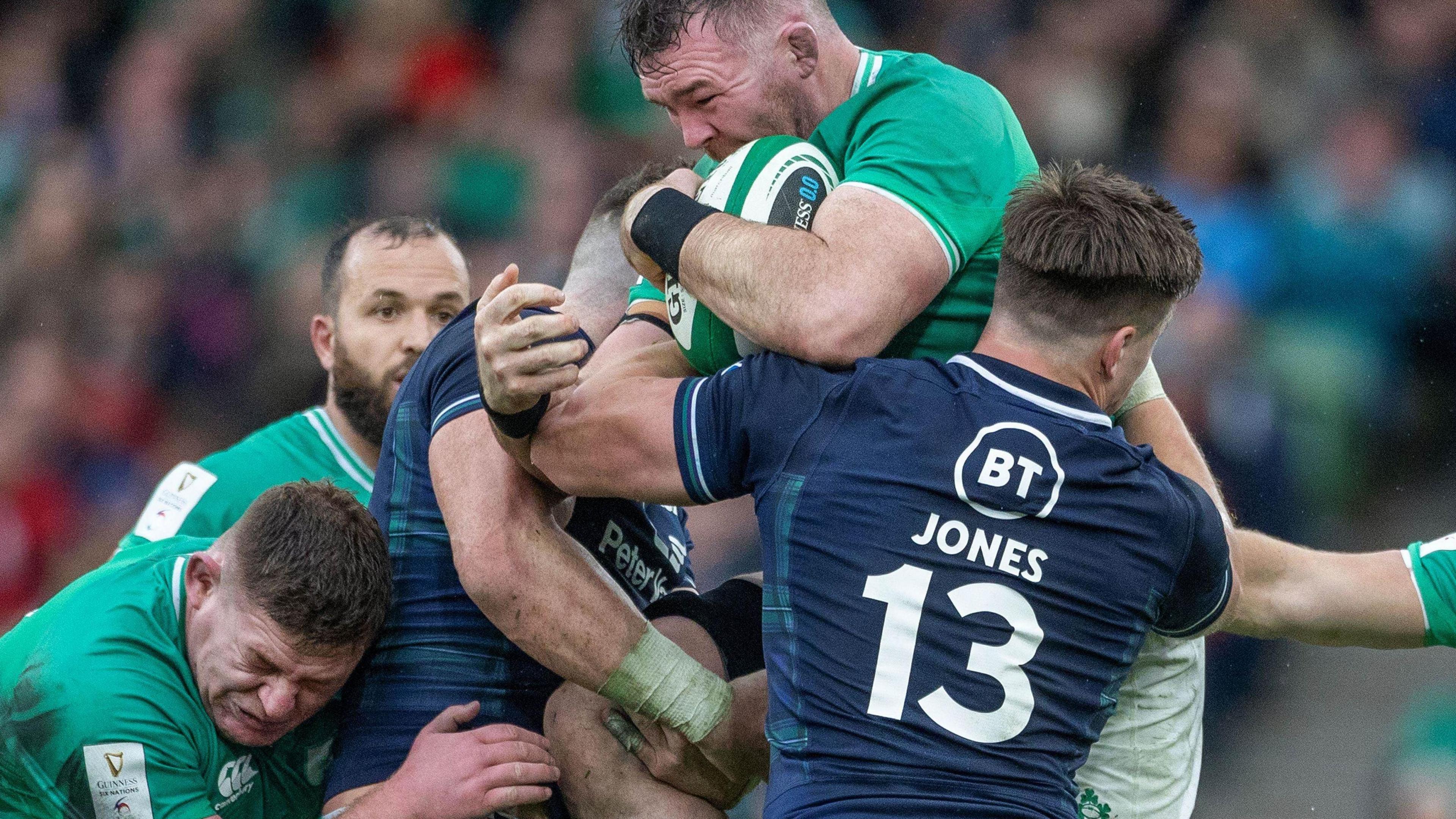 Peter O'Mahony is tackled by Huw Jones