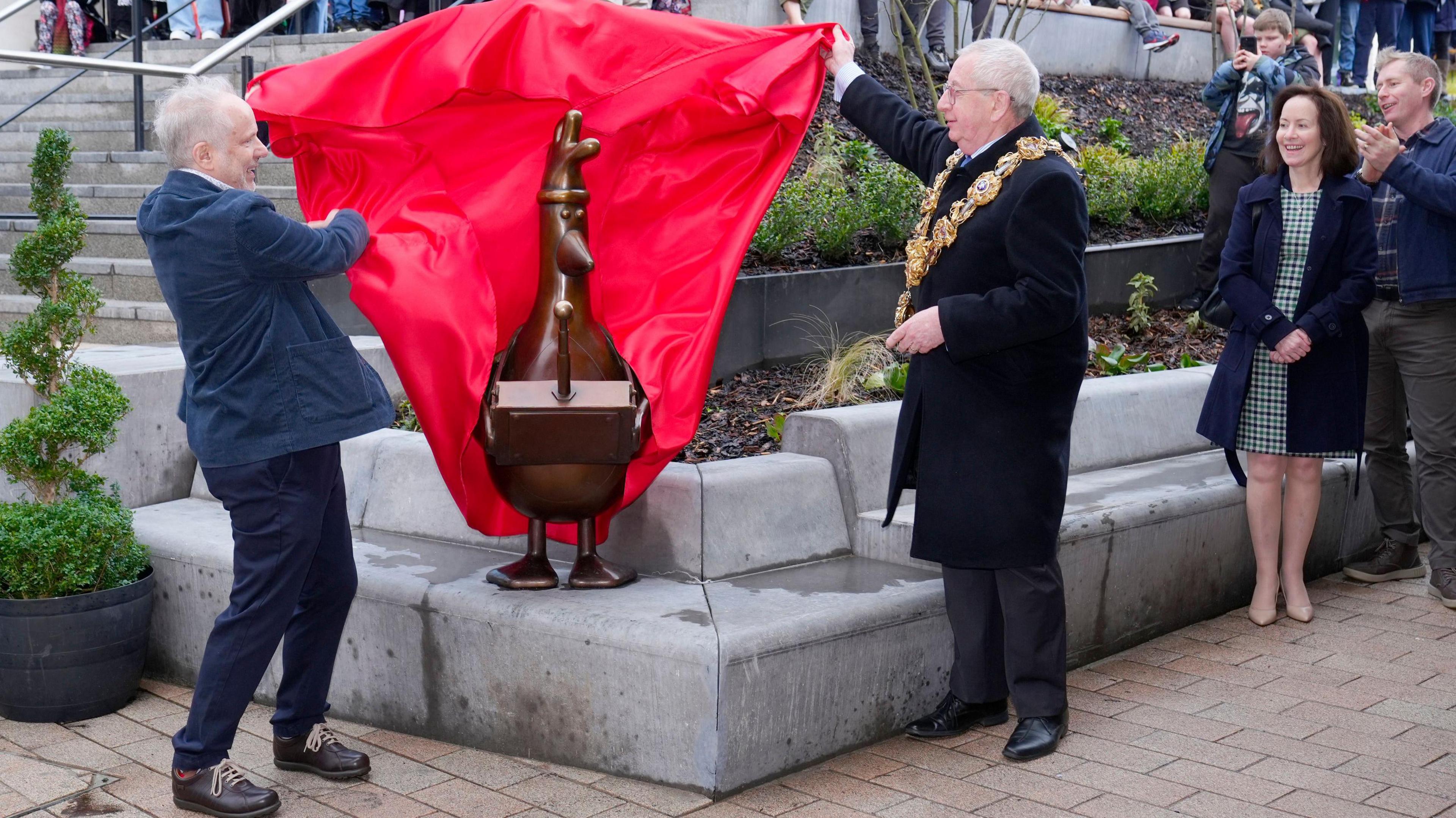 Wallace and Gromit creator Nick Park (left) and the Mayor of Preston, Councillor Phil Crowe, unveil a brown statue of the animated character Feathers McGraw at the opening of Animate in Preston.